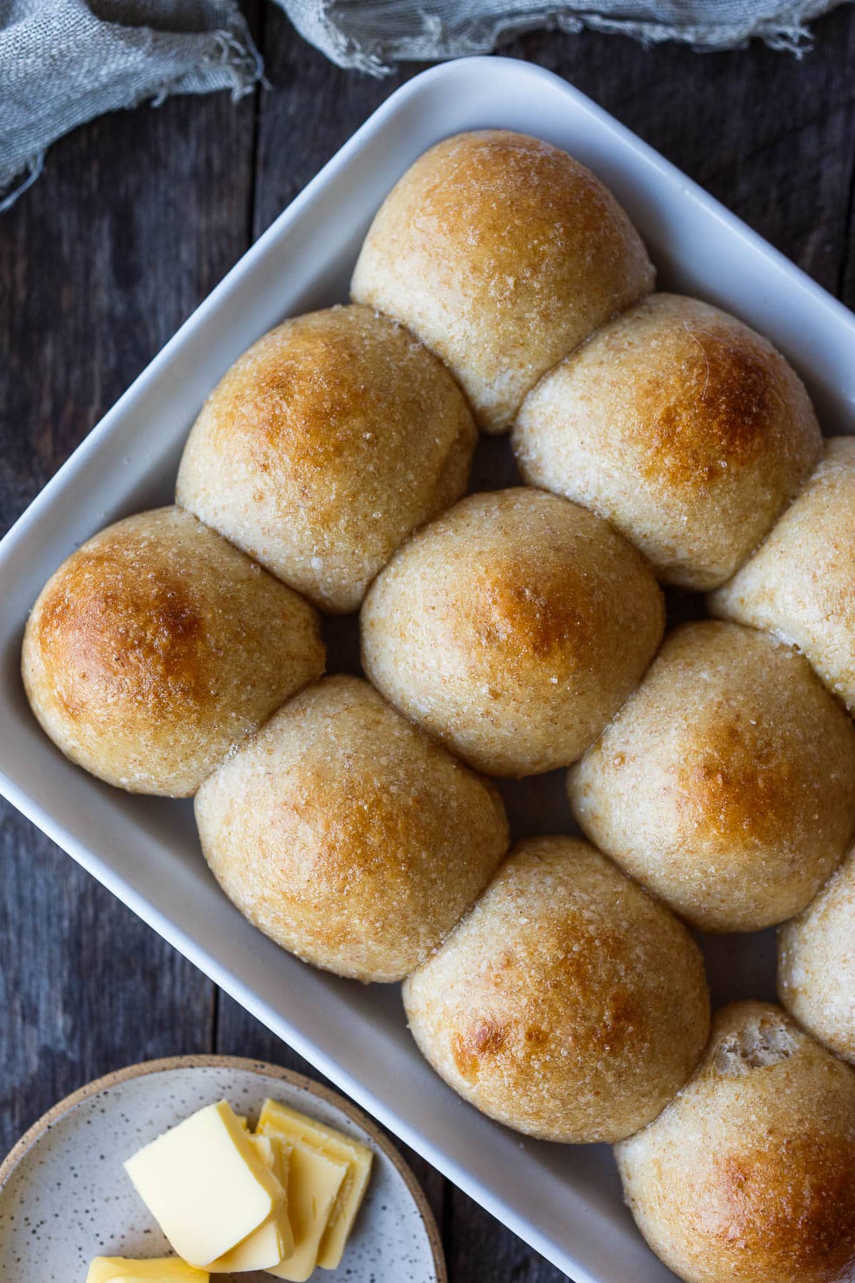 Perfectly tender and ultra flavorful sourdough dinner rolls are made completely with active starter, no yeast. Make in one day or refrigerate overnight.  They freeze well and are vegan adaptable! 
