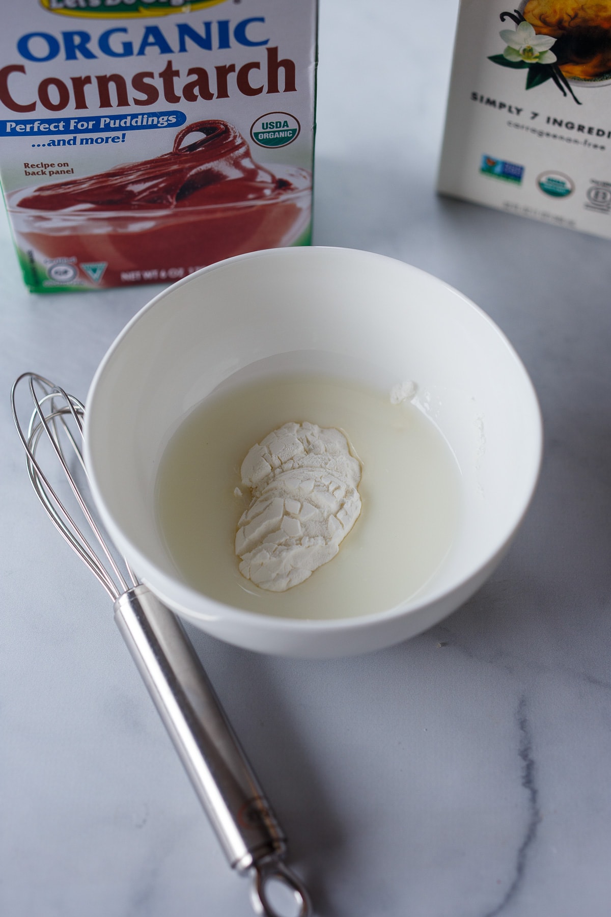 Whisking cornstarch in a bowl.