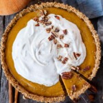 A decadent Vegan Pumpkin Tart with a smooth caramely pumpkin filling in a tender pecan oat crumb crust. Richly spiced, easy to make, and freezes beautifully. Perfect for the holidays!