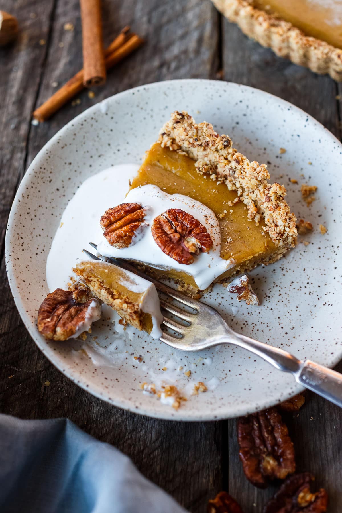 Decadent Vegan Pumpkin Tart w/ silky smooth pumpkin filling and a toasted pecan oat crust. Richly spiced, easy to make, and freezes beautifully. Richly spiced, easy to make, and freezes beautifully. Perfect for the holidays!
