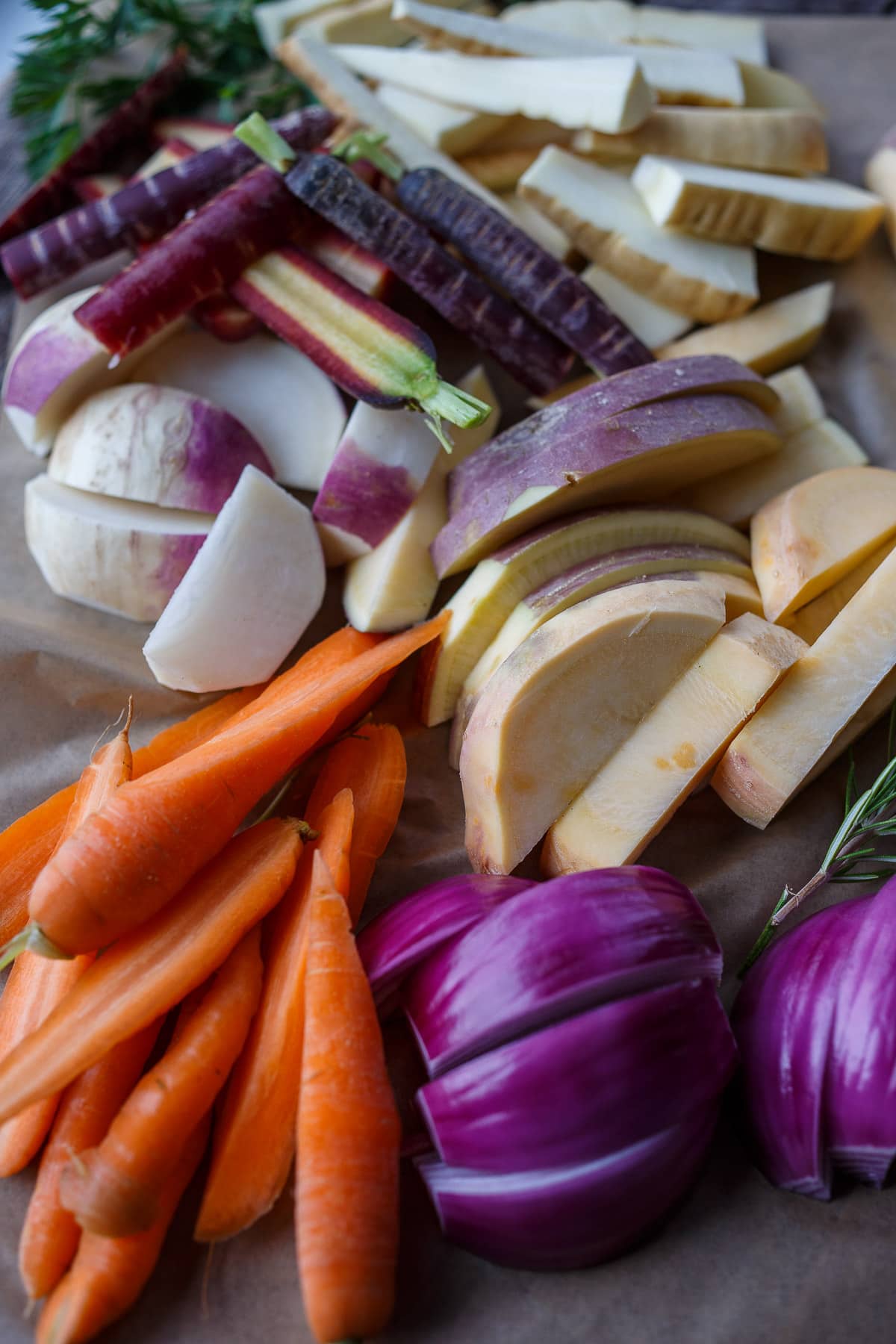 Cut rutabagas, parsnips, turnips, and carrots.