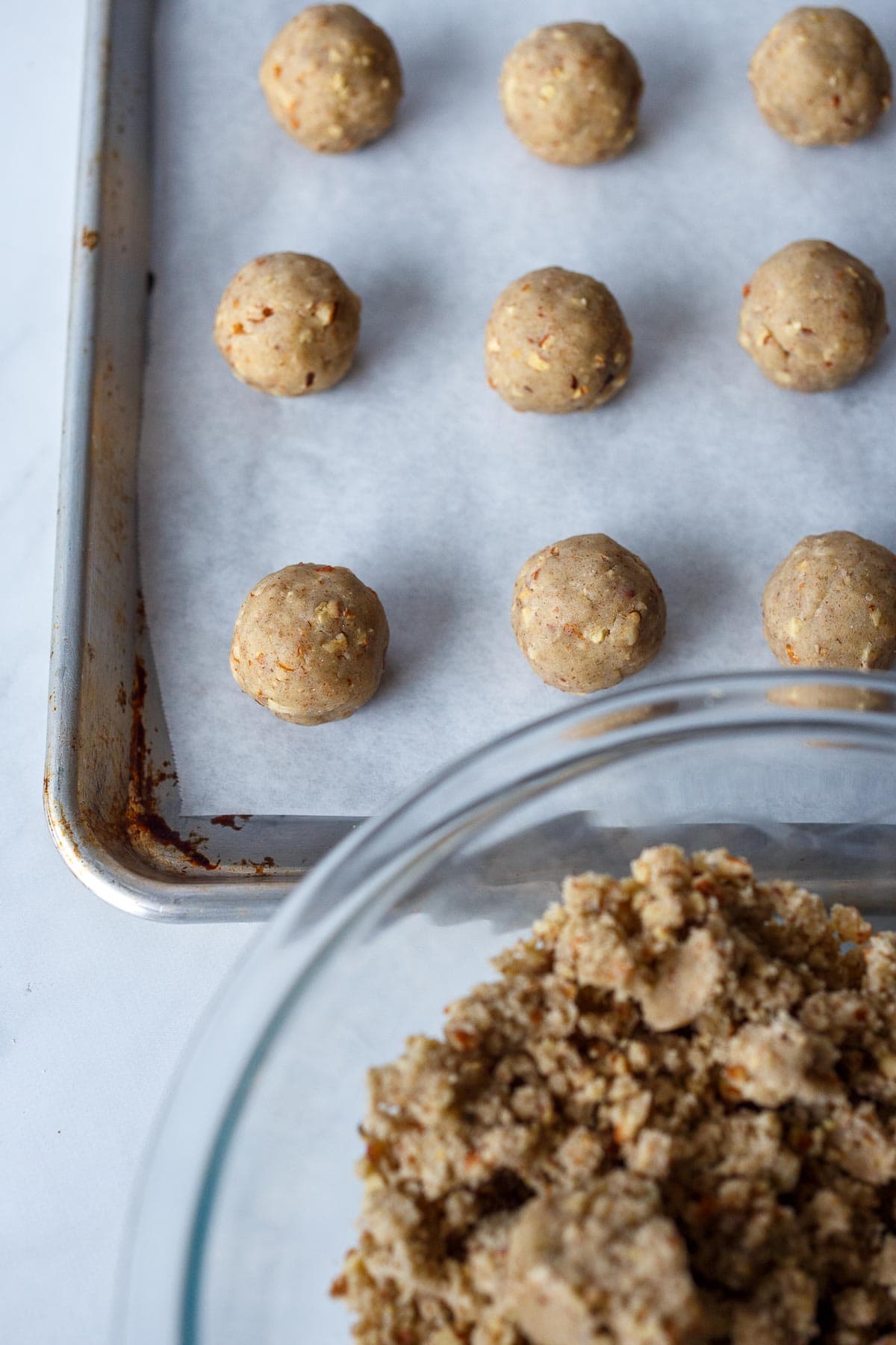 Cookies arranged on a baking sheet.