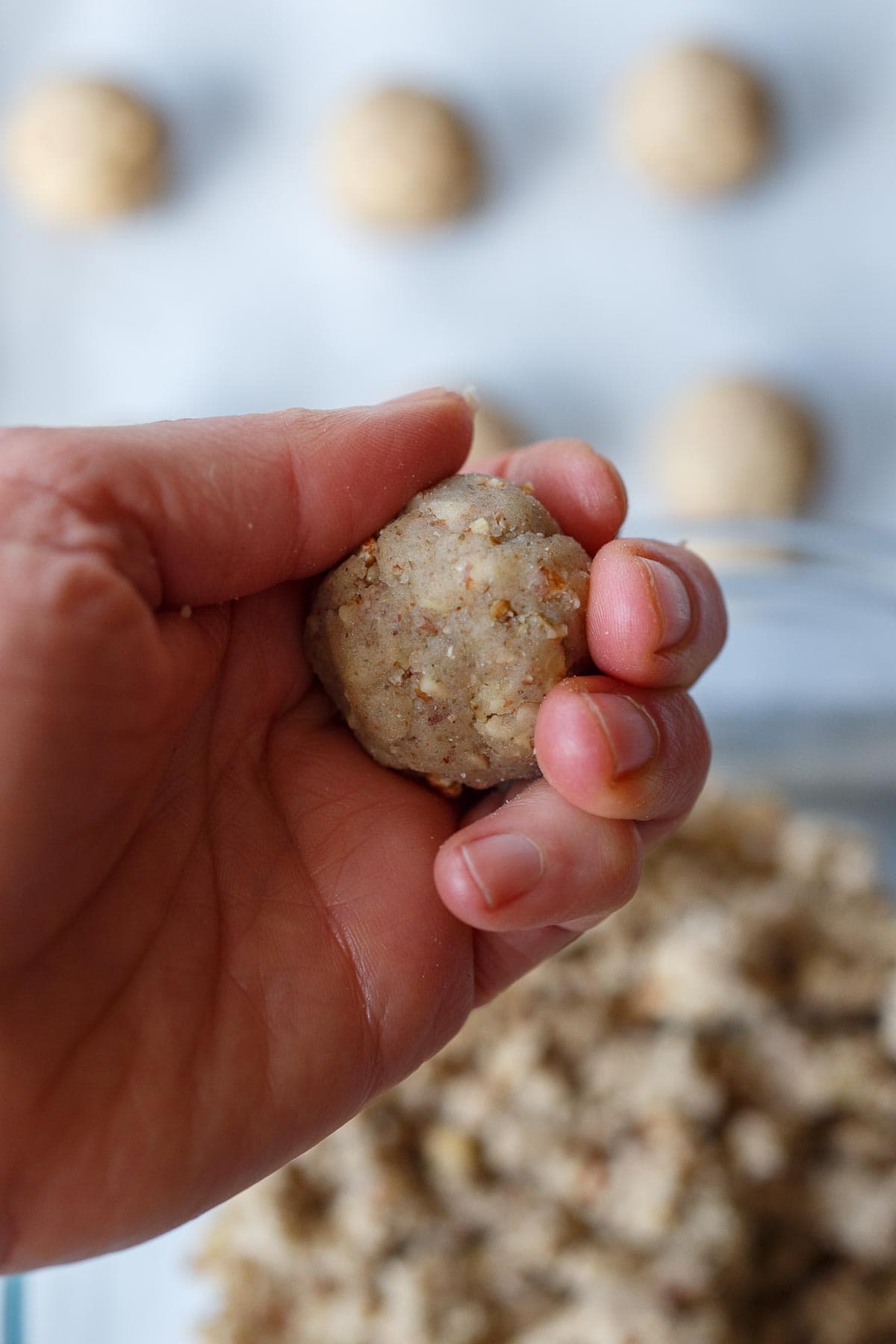 Shaping the cookies into balls.