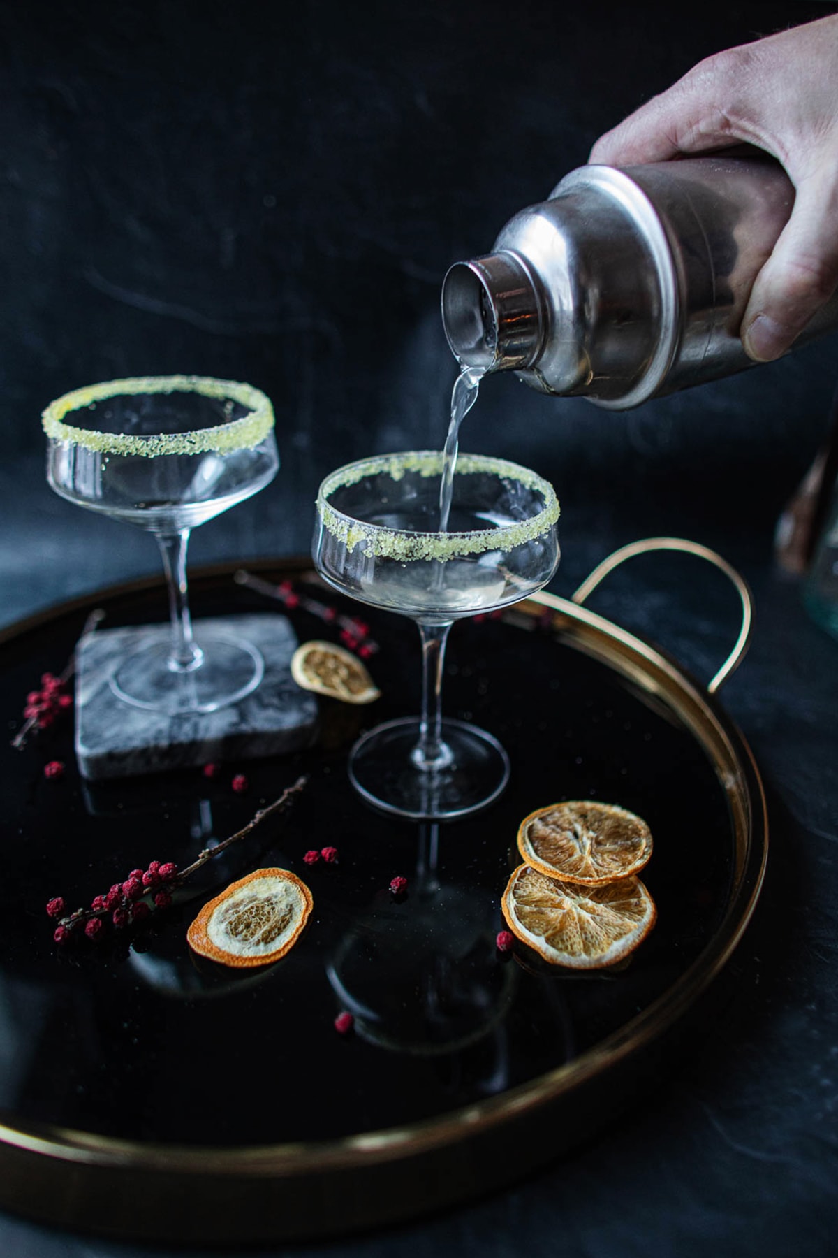 Pouring the orange blossom cocktail 