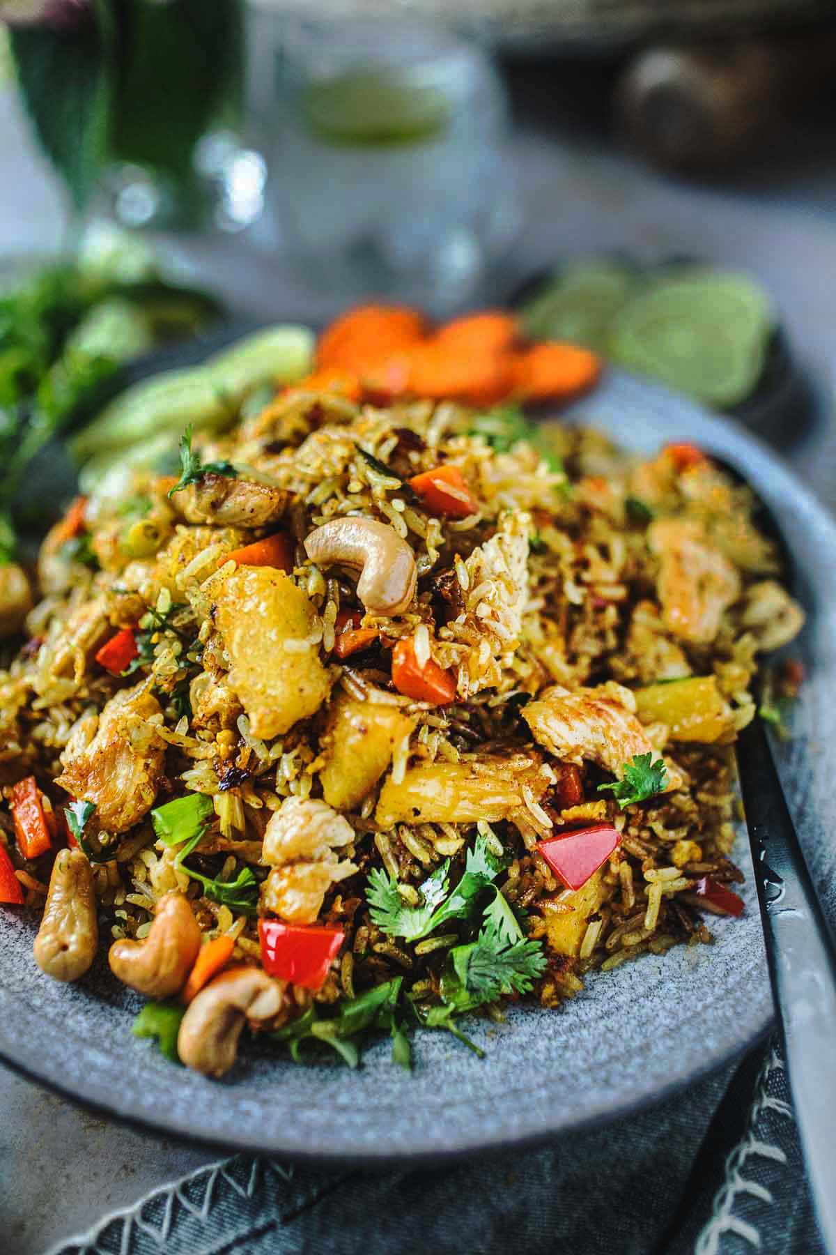 This Pineapple Fried Rice is easy to make in 30 minutes with your choice of chicken, shrimp or crispy tofu. A tasty Thai meal in minutes!