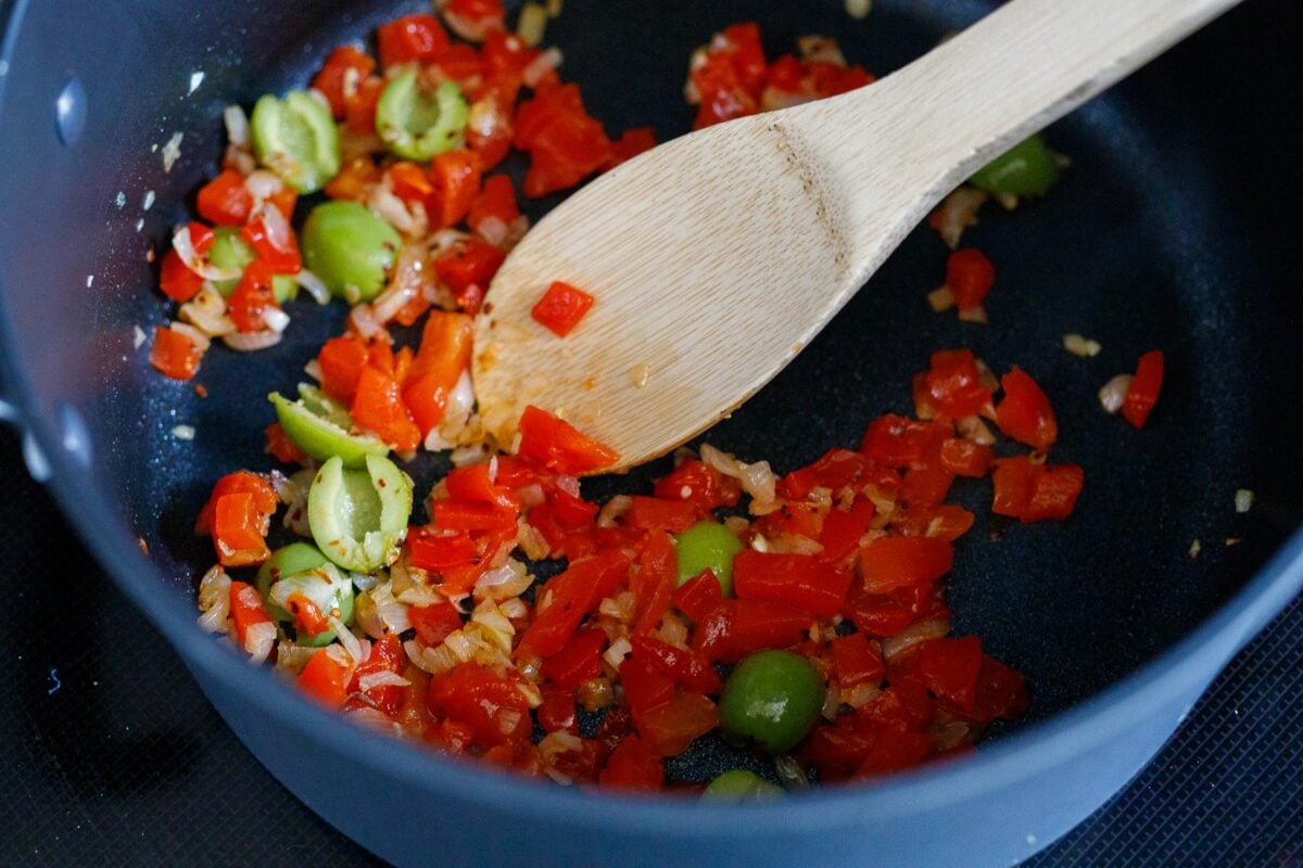 sautéing onion, pepper and wolves