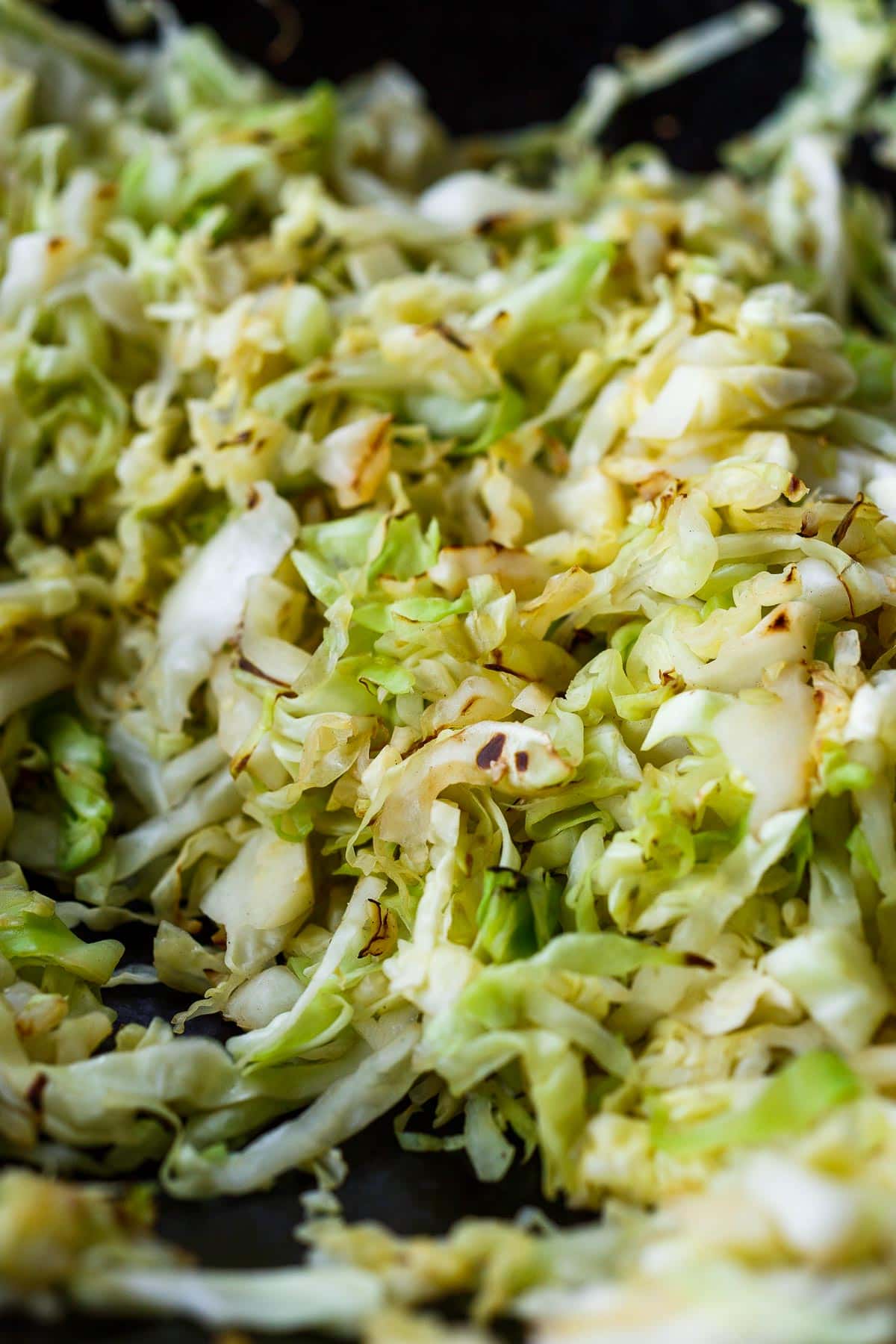 Cabbage lightly charred in wok.