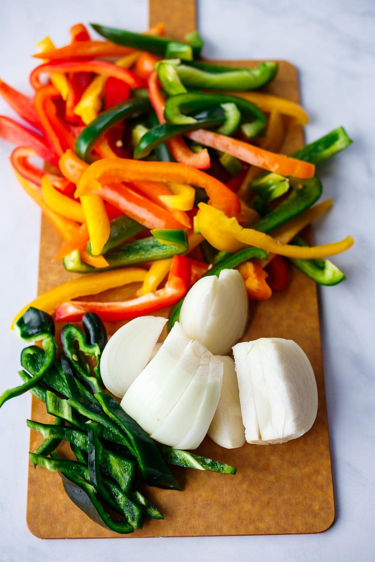 Bell peppers and onions cut into strips.