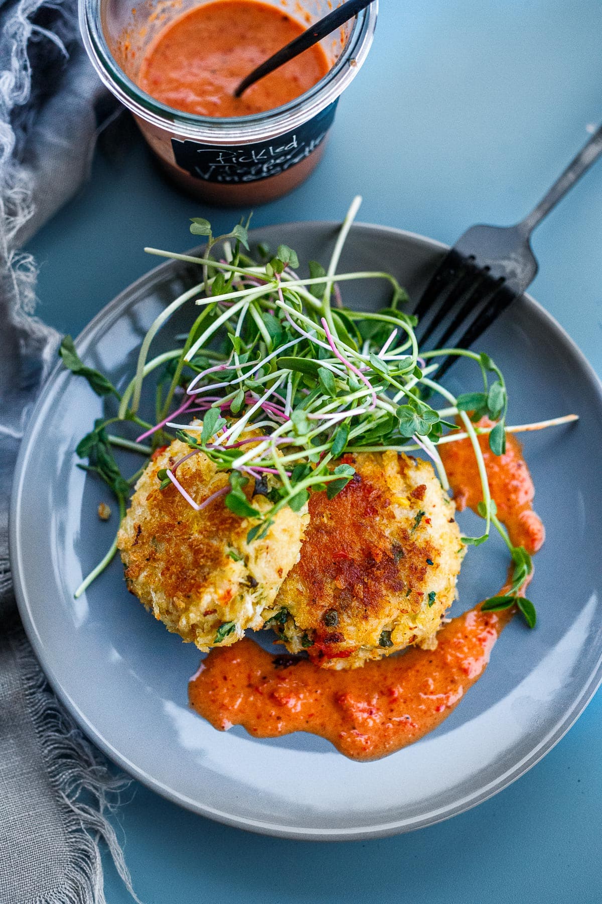 These zesty crab cakes are made with fresh crab, lime zest, cilantro and jalapeño, served up with a red pepper vinaigrette. Makes 6 large crab cakes, or 12 small appetizer crab cakes. 