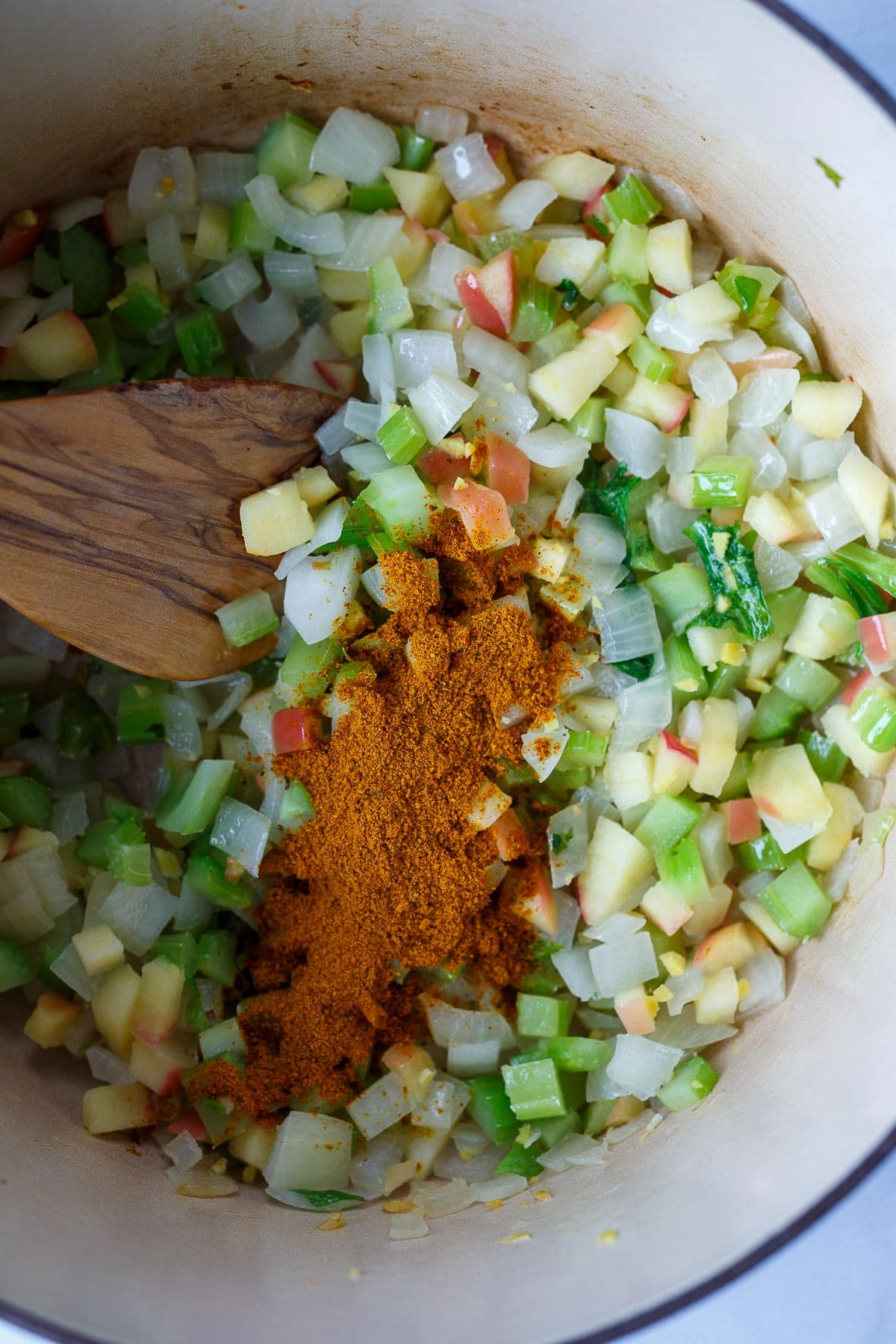 Sautéing vegetables and curry powder.