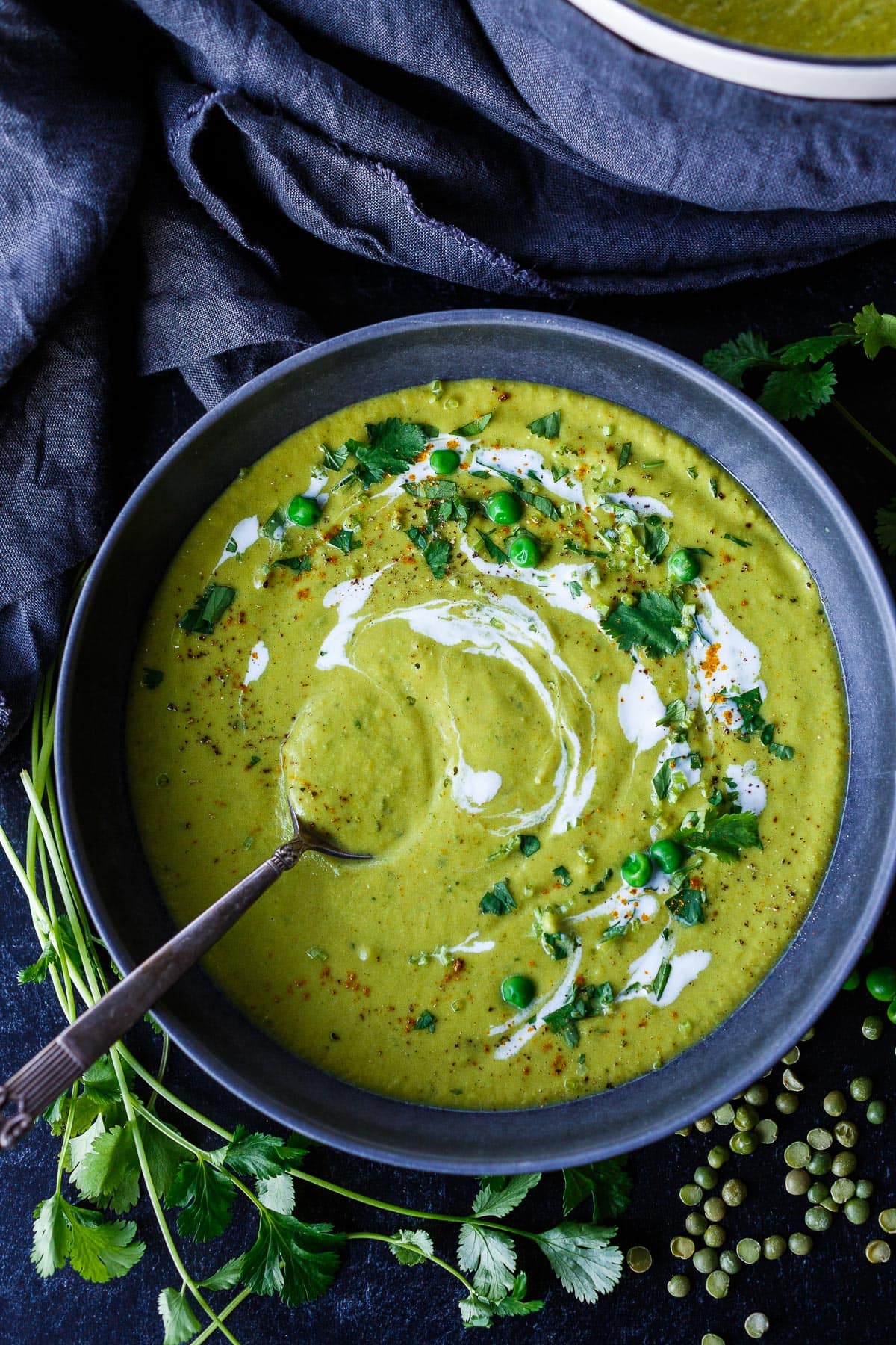 Curried split Pea soup in a bowl with a spoon.