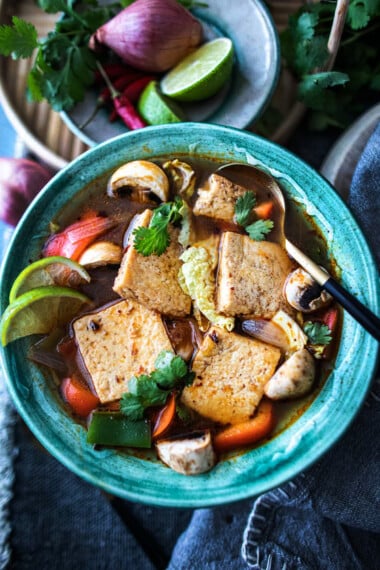 Delicious and warming, Tom Yum Soup is a classic Thai soup that is best known for its clear, sour broth infused with lemongrass and galangal. Make this vegetarian with tofu, or add shrimp or chicken!