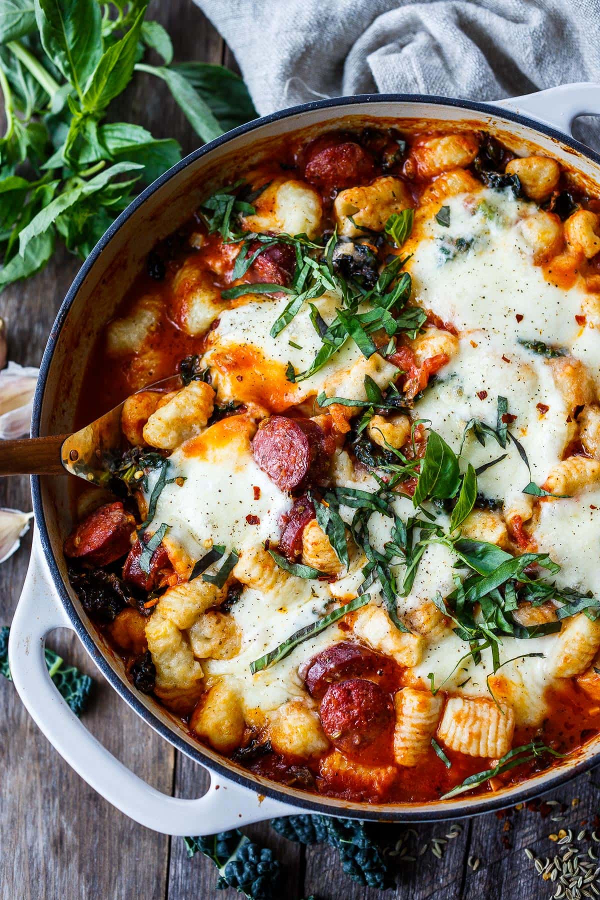 Baked Gnocchi with tomato sauce, kale, Italian sausage and melty mozzarella cheese - a delicious one-pan meal that can be made in 30 minutes.