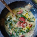 This Portuguese soup called Caldo Verde has a luscious creamy potato base, with collard green ribbons, and smoked sausage. A delicious one-pot meal that is vegan-adaptable!