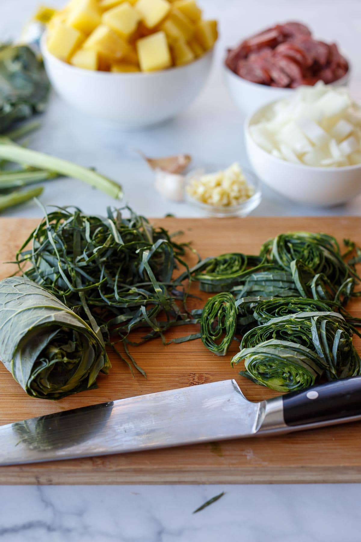Chopped ingredients and collard green ribbons.