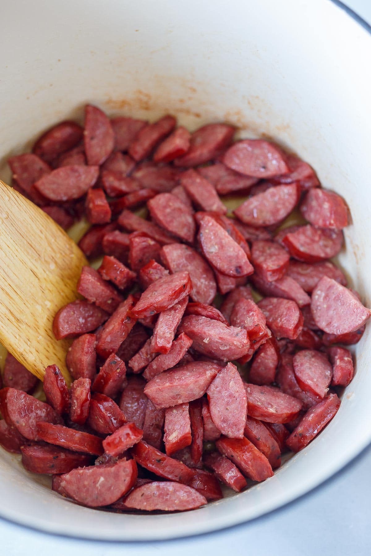 Cooking sausage pieces.