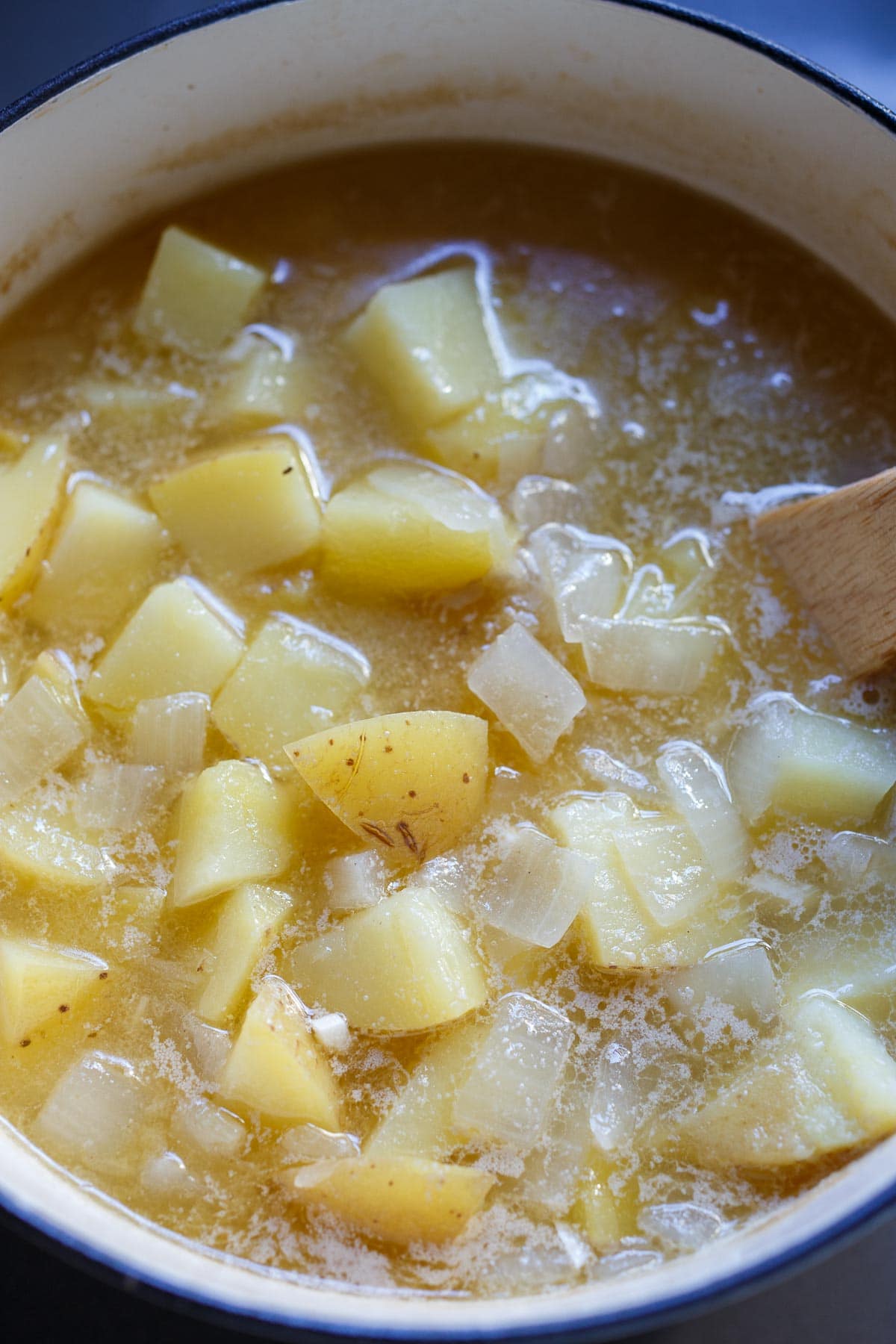 Potatoes cooking in broth.