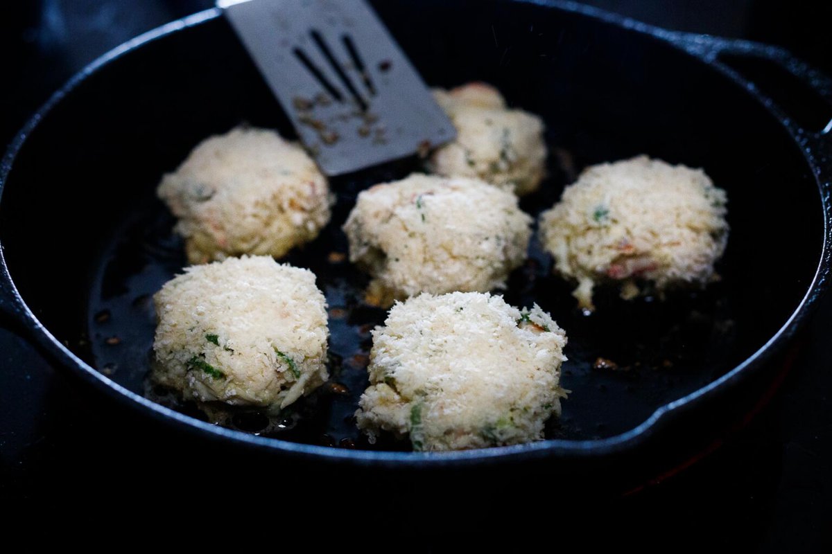 Searing the crab cakes.