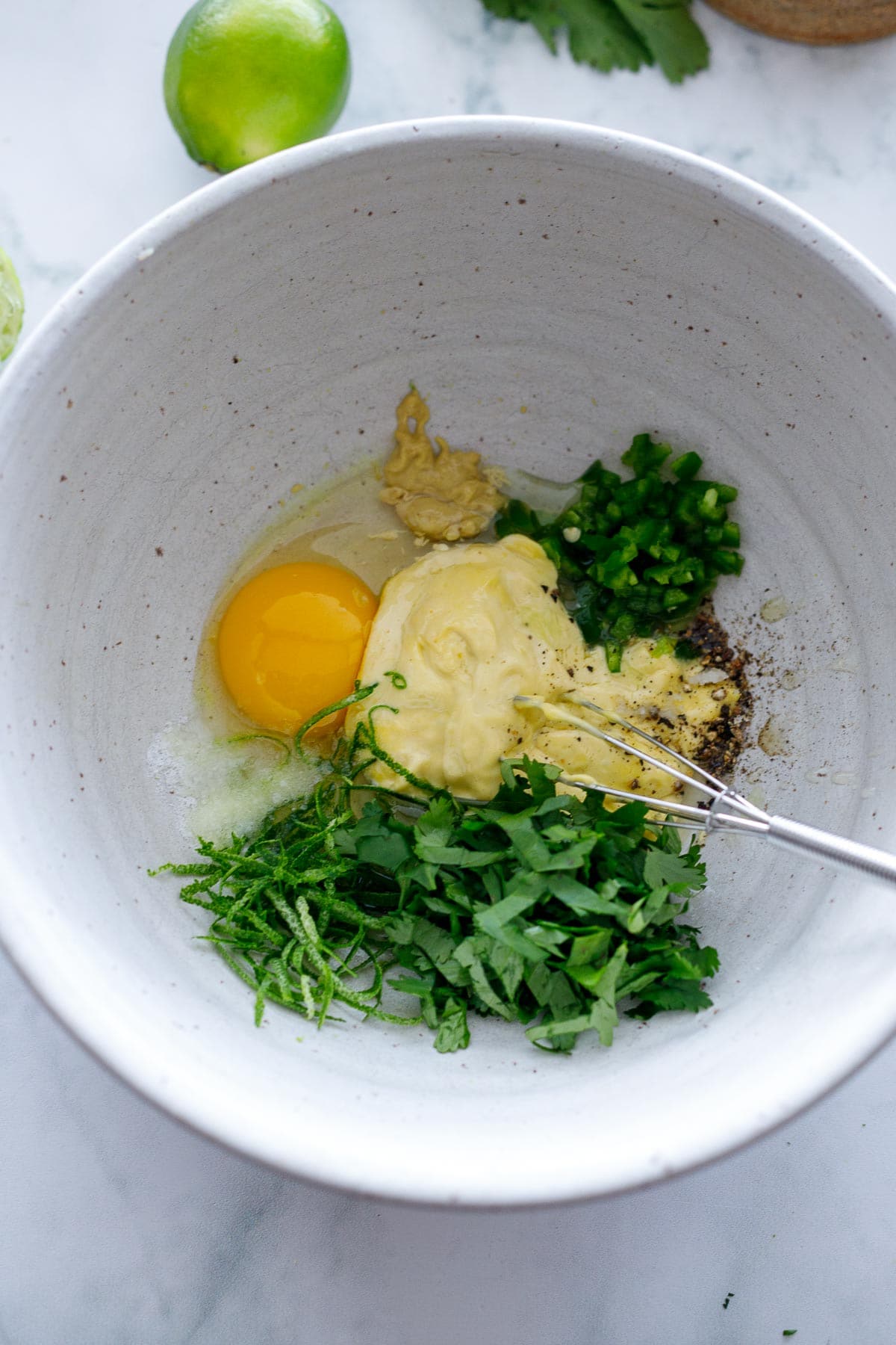 Mixing wet ingredients in a bowl.