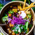 Bursting with flavor, this Vegan Pozole with black beans and hominy is richly spiced with deep complex flavors. Quick and easy to make!