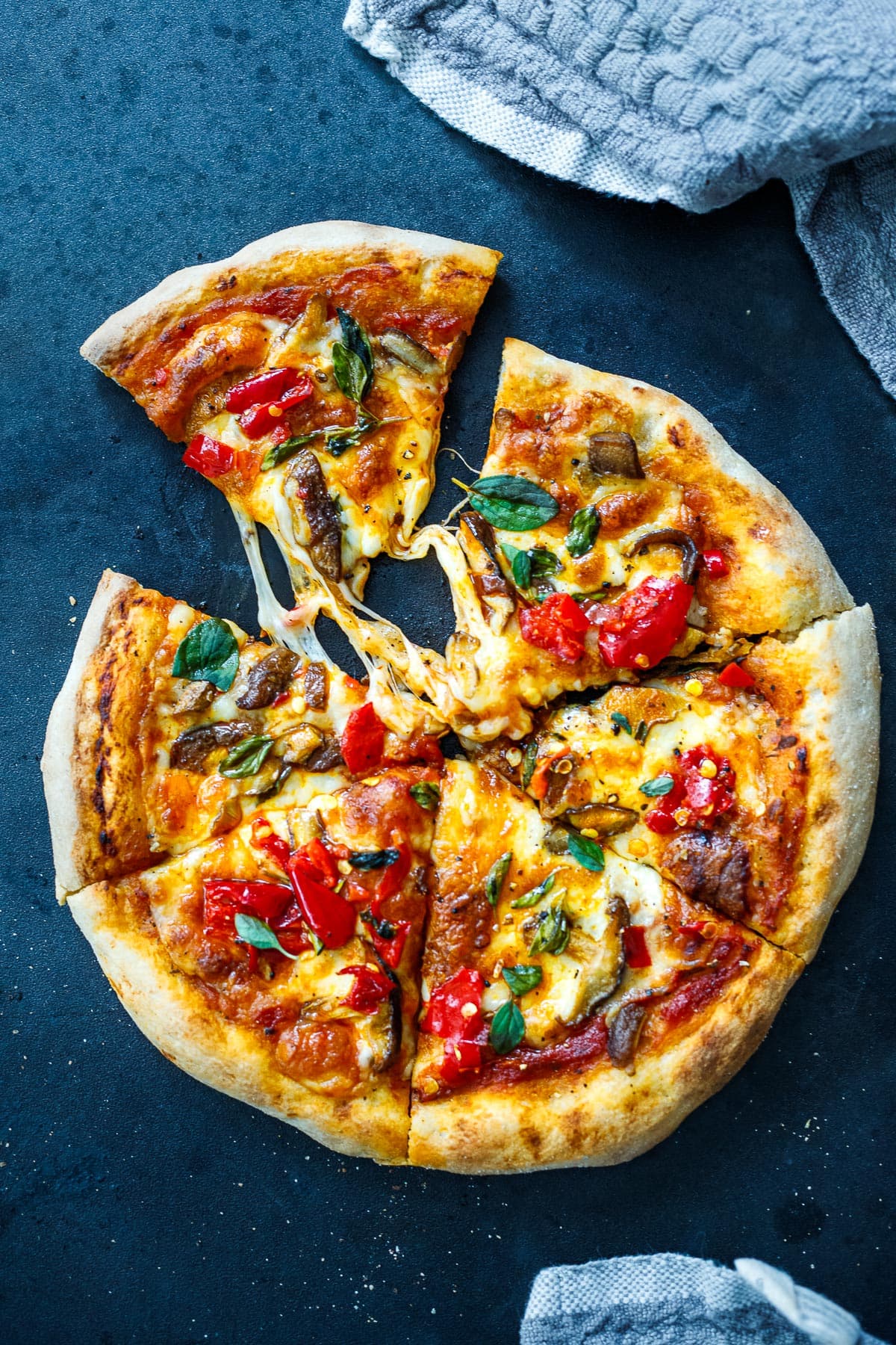 Sourdough Pizza. A baked sourdough pizza, right out of the oven, with melty cheese.