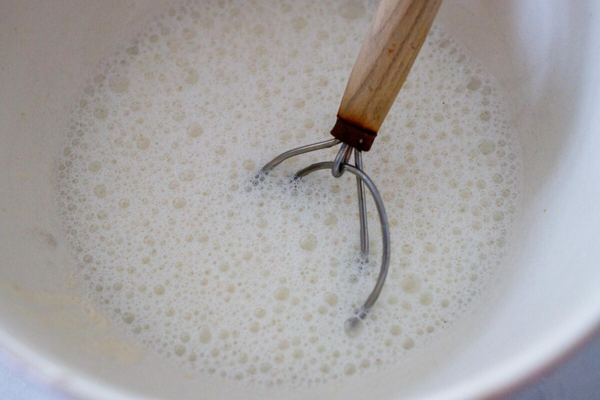 mixing sourdough starter and water.