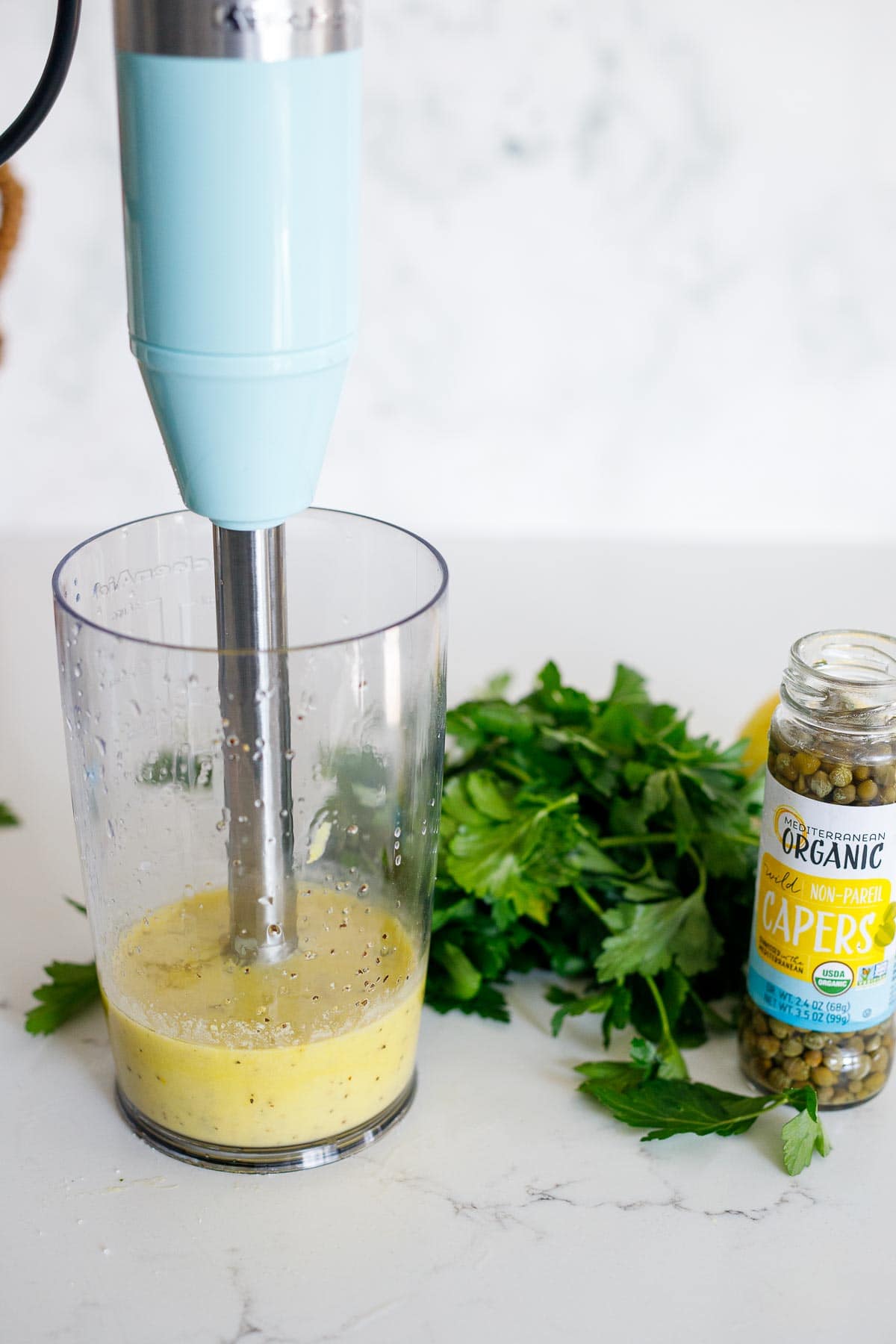 Blending oil, anchovies and garlic.