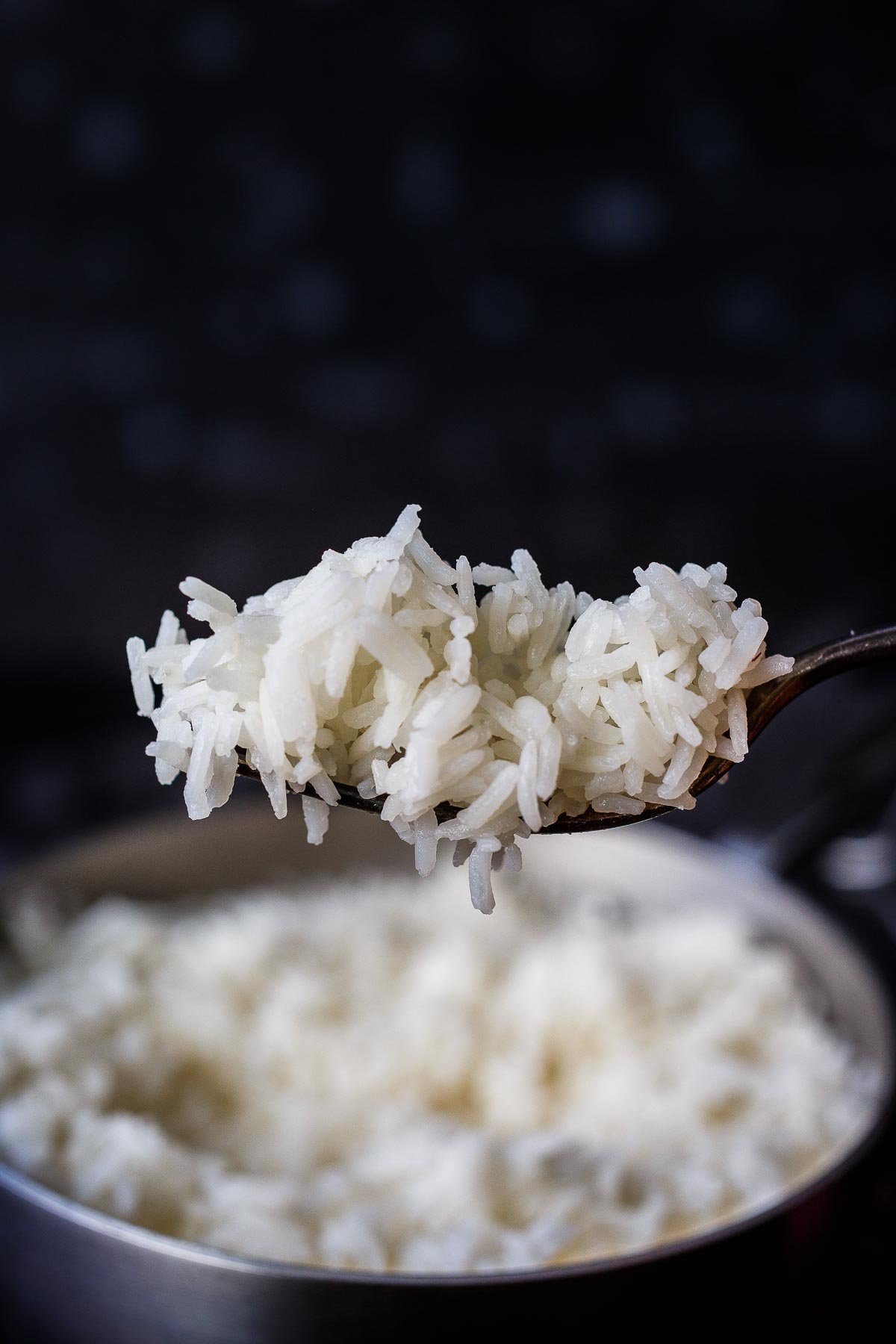 Fluffy fragrant Jasmine Rice on a fork. 