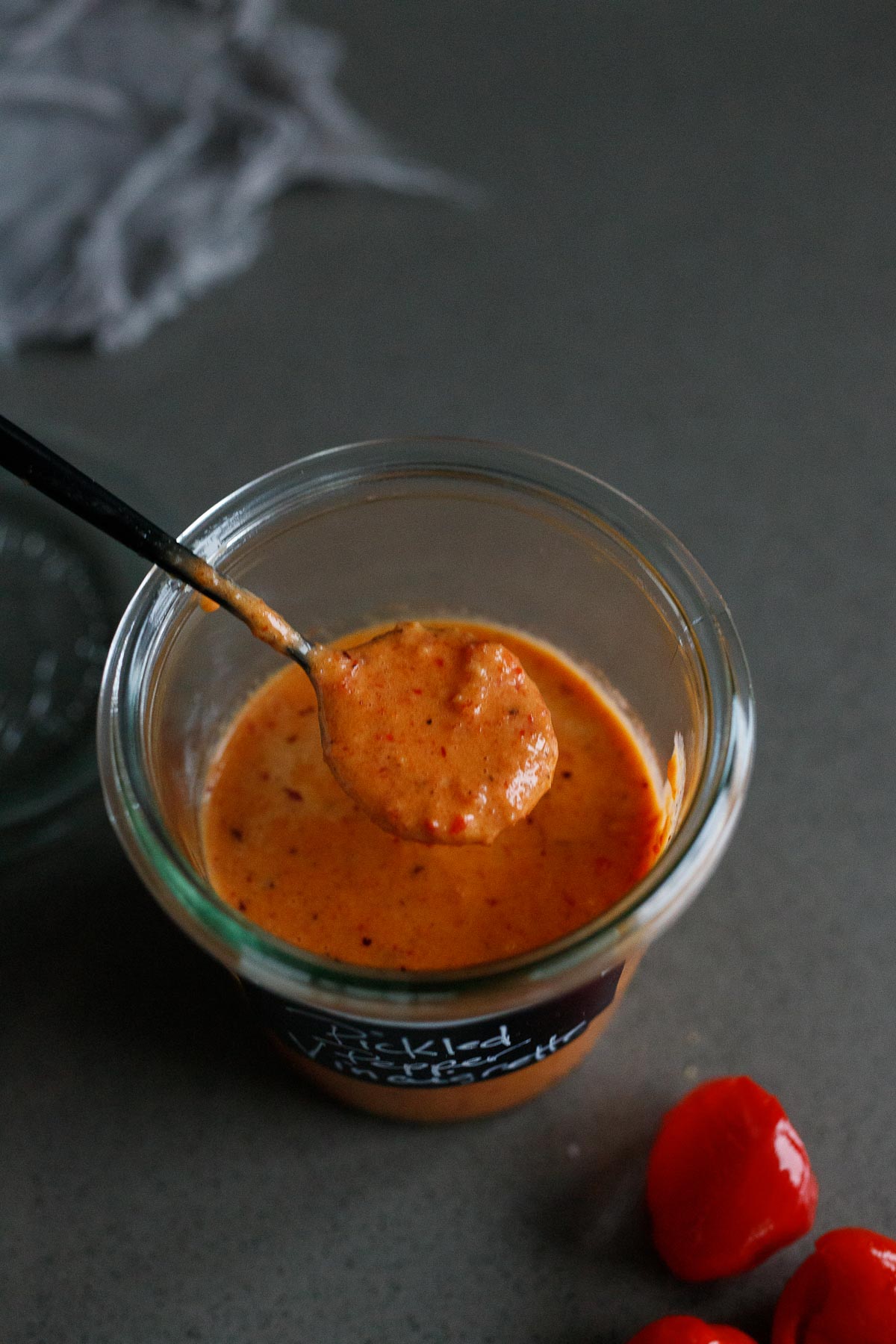 pickled pepper dressing in a spoon. 