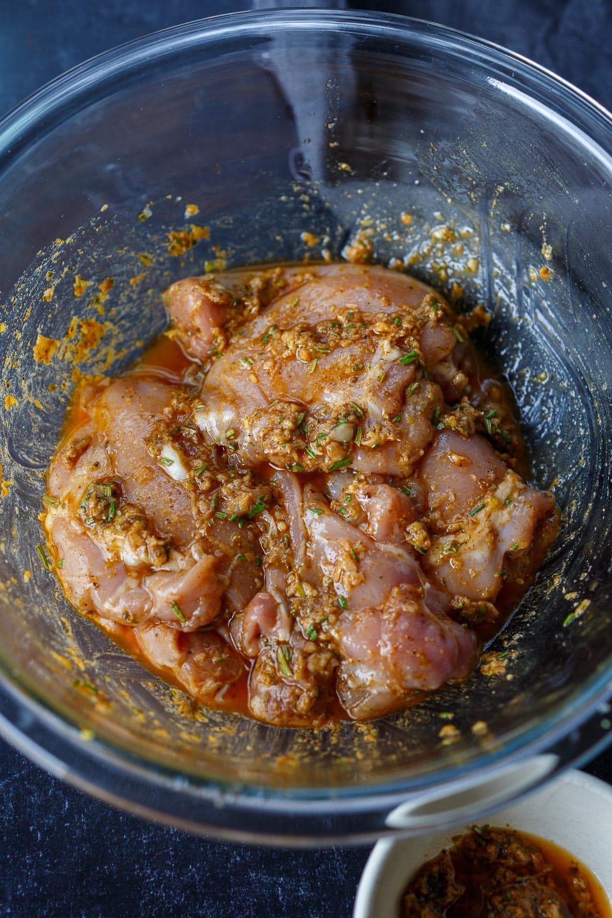 Chicken thighs marinating.