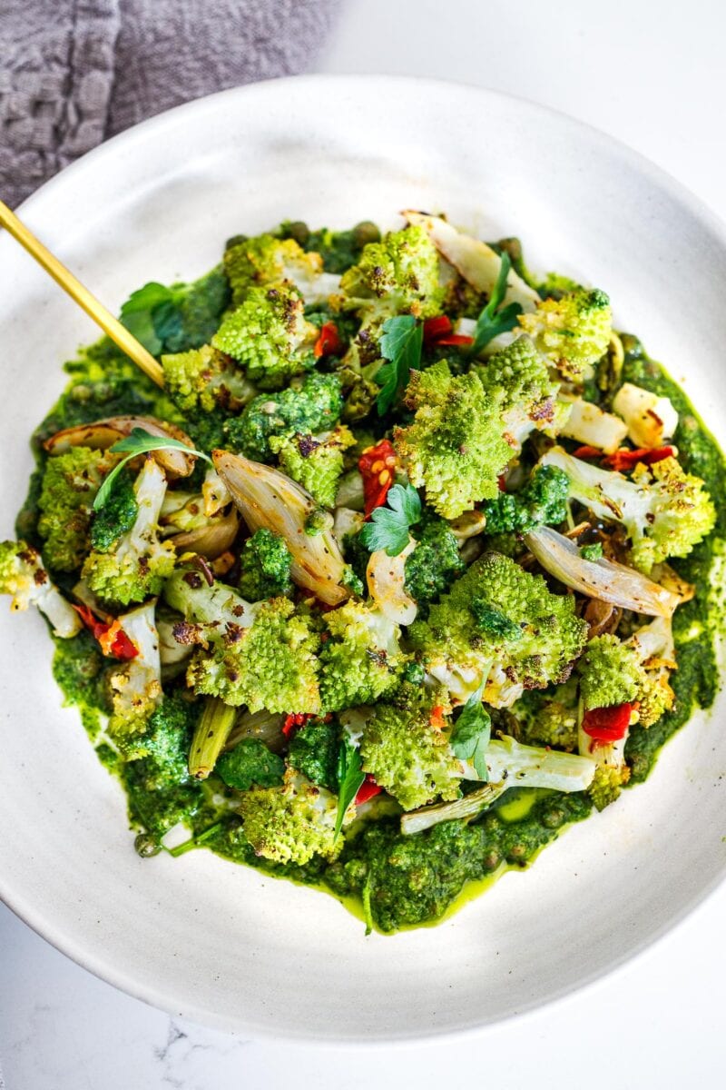 How to cook Romanesco- broccoli and cauliflower's Italian cousin. Her we've roasted with garlic, shallots, & lemon, and served it with Italian Salsa Verde & Calabrian chilies.