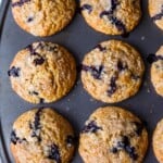 Tender Blueberry Muffins lightly sweetened, enhanced with lemon zest, vanilla and cardamom made with fresh or frozen blueberries. A delicious breakfast or afternoon snack. Gluten-free adaptable.