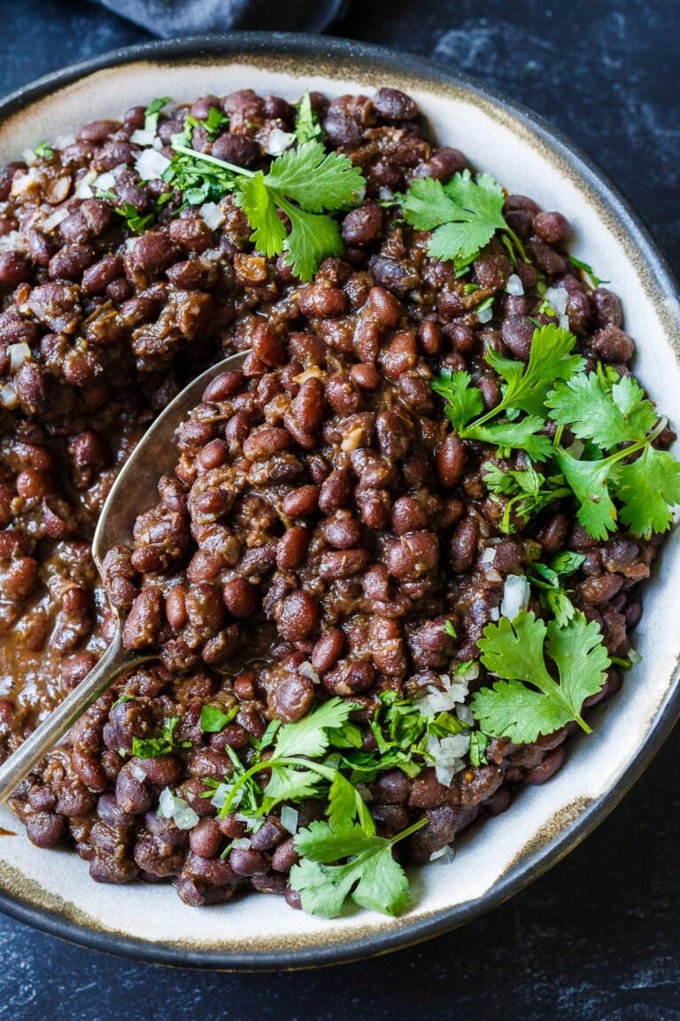 Full of savory flavor, these Cuban Style Black Beans are made with dry black beans and simple seasonings. A healthy side dish that will complement many dishes. The recipe card includes instructions for Stove Top, Instant Pot, and canned beans. Vegan!