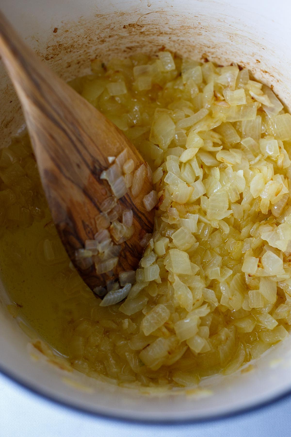 Sautéed onions in a pot.