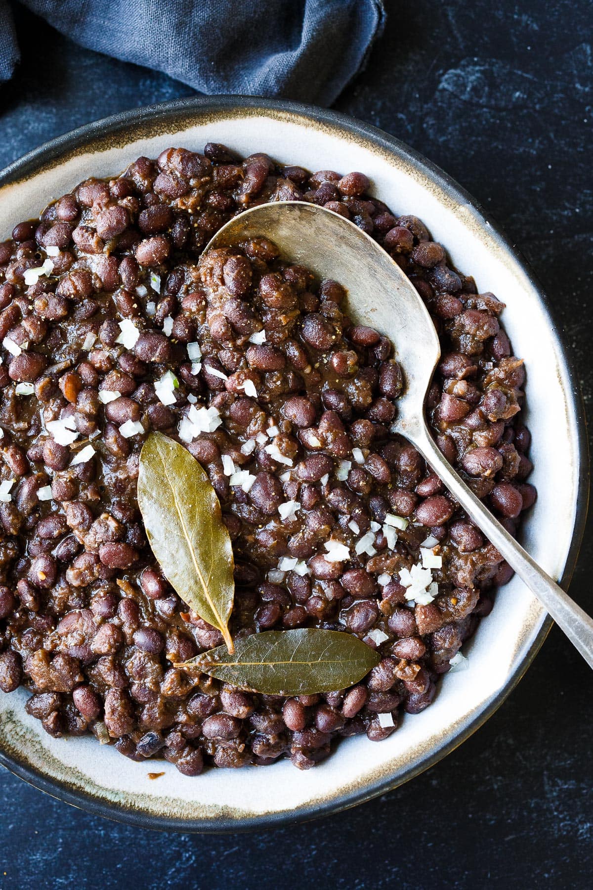 Full of savory flavor, these Cuban Style Black Beans are made with dry black beans and simple seasonings. A healthy side dish that will complement many dishes. The recipe card includes instructions for Stove Top, Instant Pot, and canned beans. Vegan!