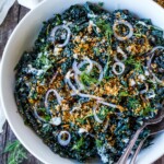 Full of healthy texture and flavor, this nutrient-dense Kale Salad with creamy buttermilk dressing and tamed red onions is sprinkled with an addicting crunchy salad topper.