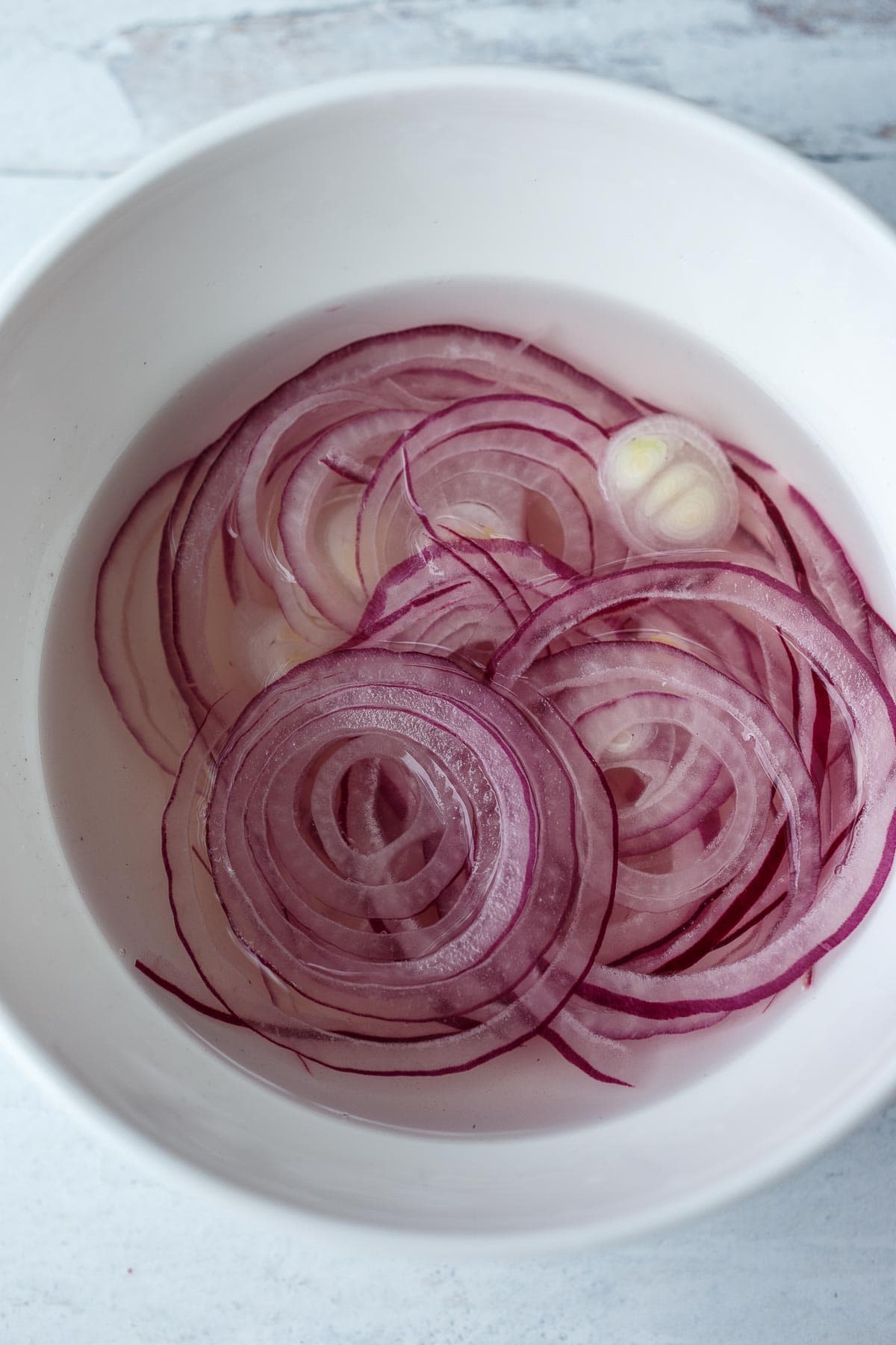 Red onions in a bowl.