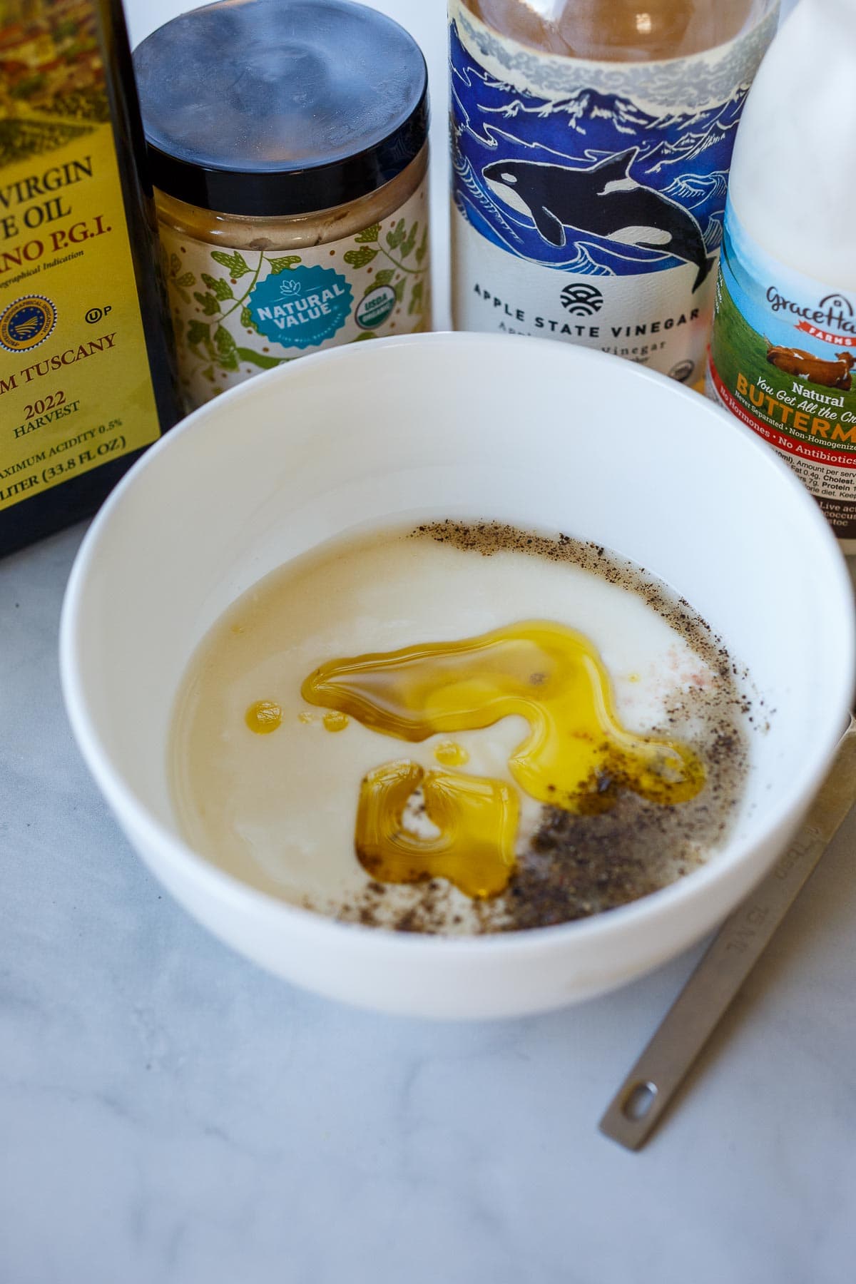 Mixing buttermilk dressing.