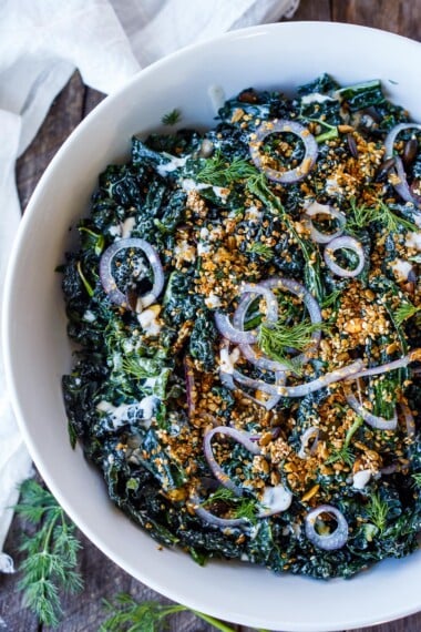 Full of healthy texture and flavor, this nutrient-dense Kale Salad is enhanced with creamy buttermilk dressing, tamed red onions, and an addicting crunchy quinoa salad toppe