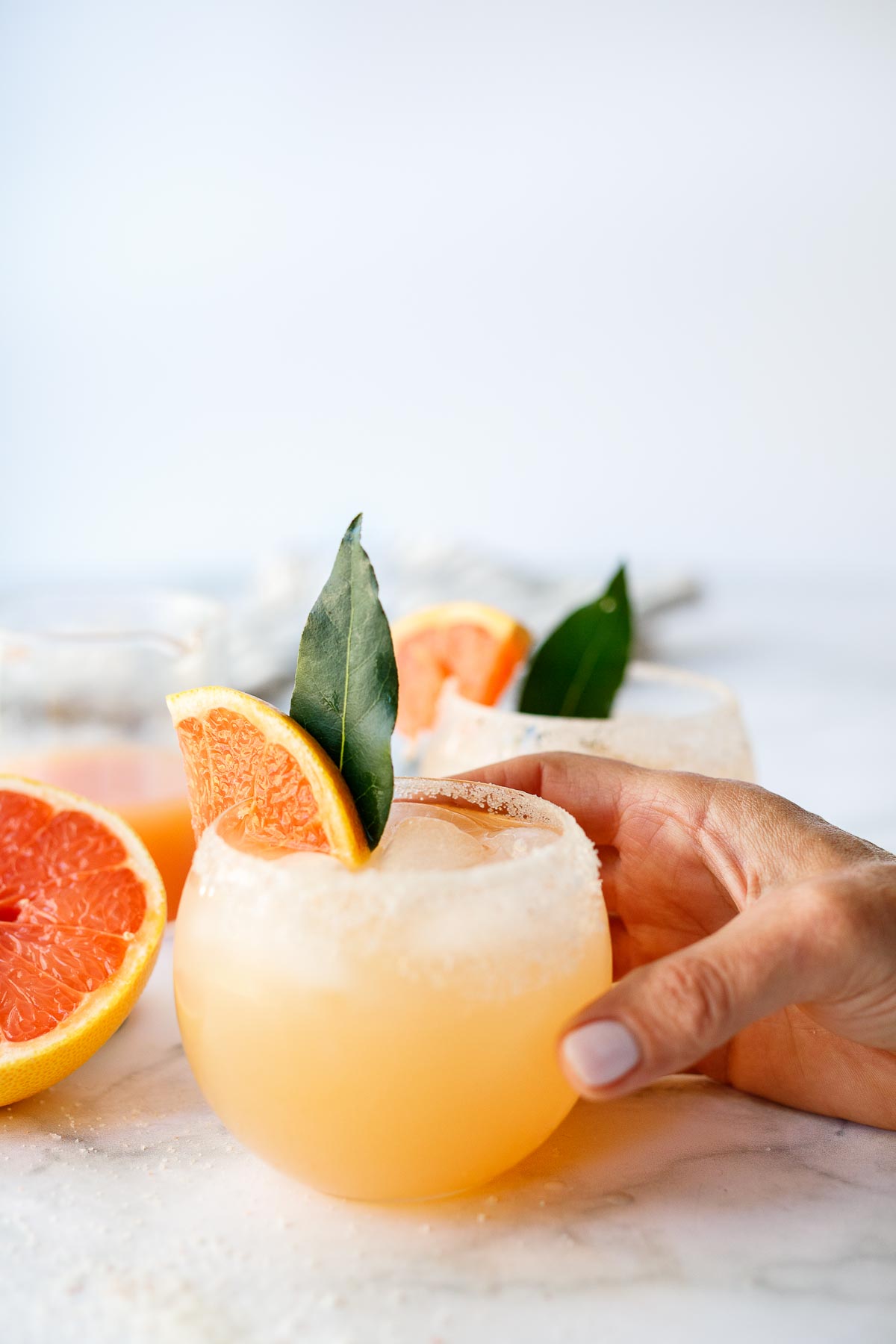 This Paloma cocktail features fresh grapefruit juice and lime juice, tequila blanco and honey simple syrup with a splash of sparkling water. Light and refreshing, it goes down easy. 