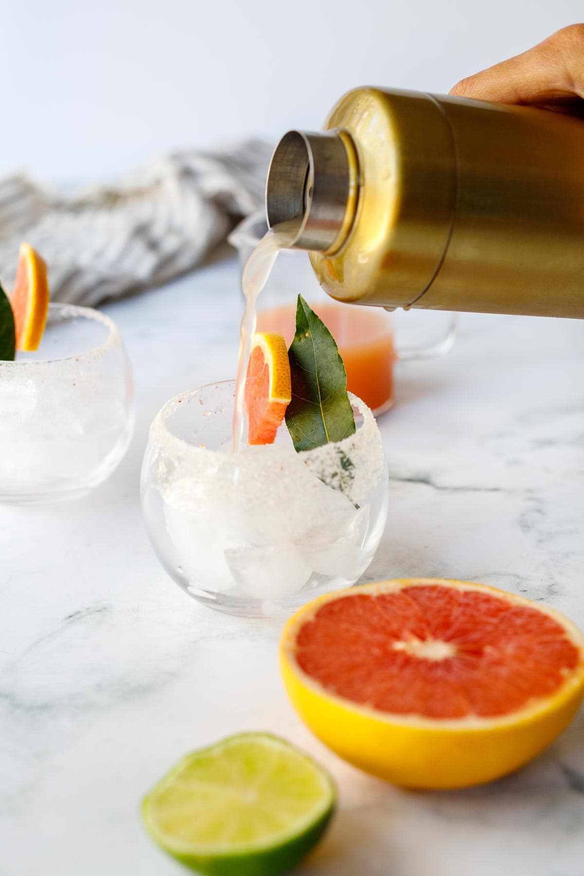 pouring a Paloma into a glass