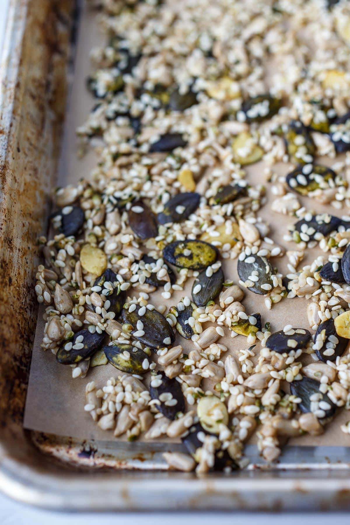 Seeds roasting on a sheet pan.