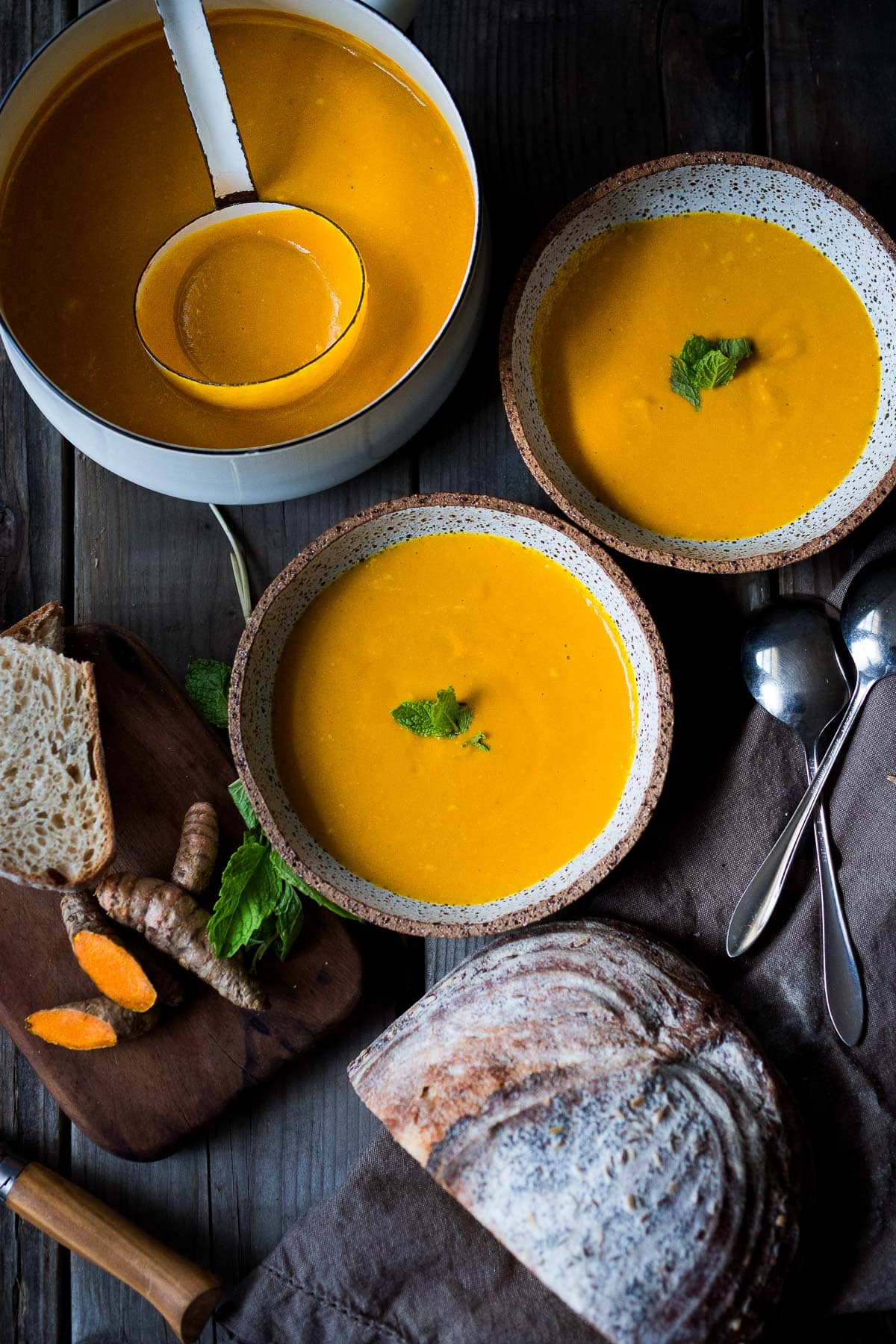 A simple recipe for Glowing Carrot Ginger Soup with turmeric and  Coconut Milk is light, luscious, earthy and flavorful. Fresh turmeric root gives it a hint of the exotic.