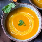 A simple recipe for Glowing Carrot Ginger Soup with turmeric and  Coconut Milk is light, luscious, earthy and flavorful. Fresh turmeric root gives it a hint of the exotic.