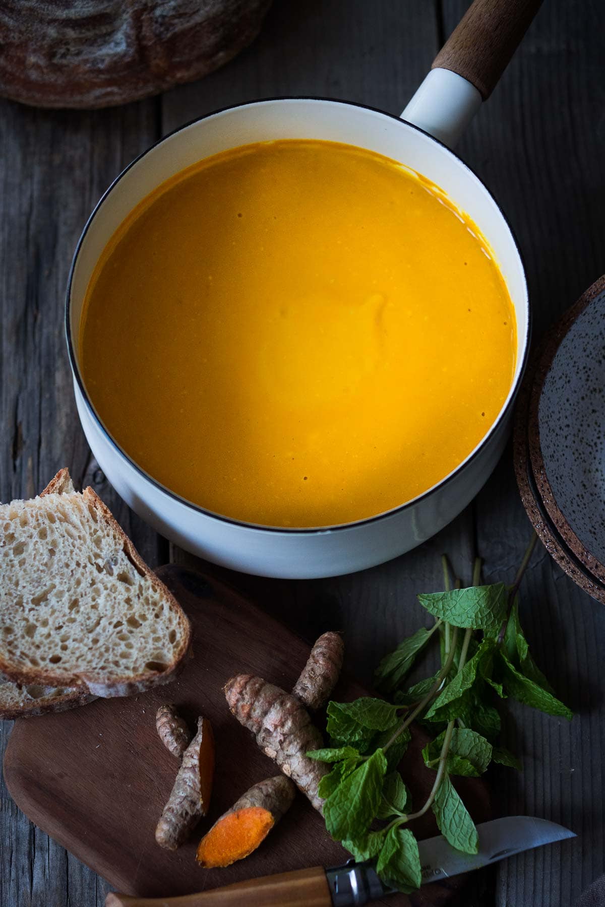 A simple recipe for Glowing Carrot Ginger Soup with turmeric and  Coconut Milk is light, luscious, earthy and flavorful. Fresh turmeric root gives it a hint of the exotic.