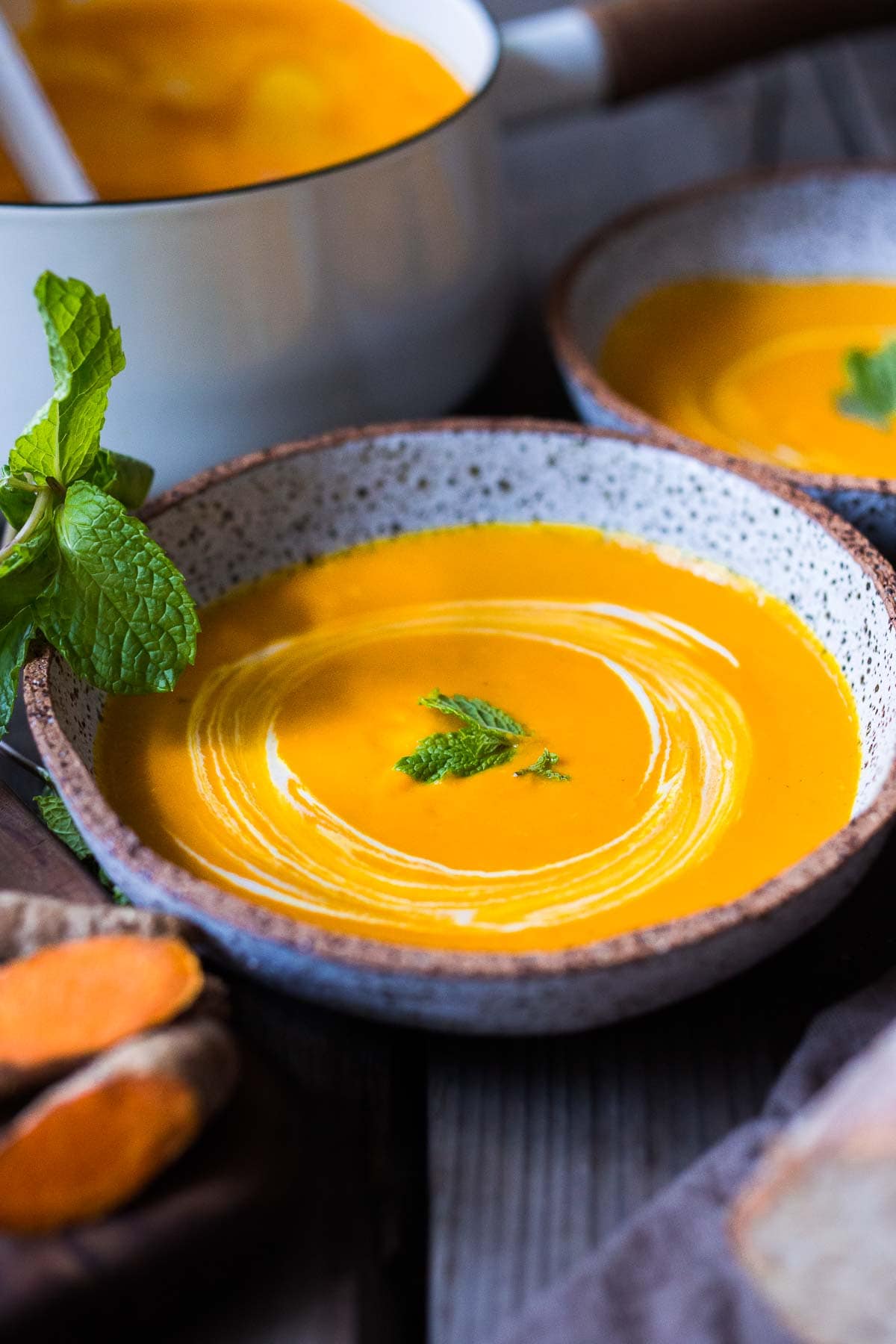 A simple recipe for Glowing Carrot Ginger Soup with turmeric and  Coconut Milk is light, luscious, earthy and flavorful. Fresh turmeric root gives it a hint of the exotic.