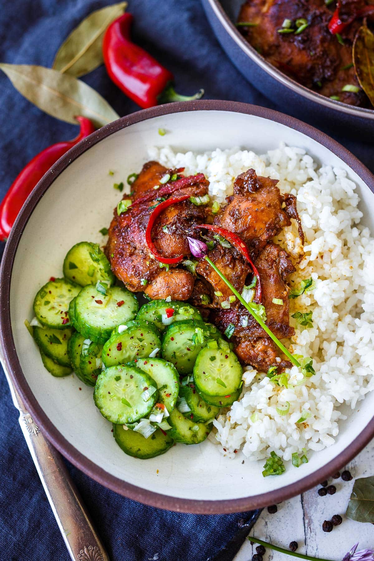 Chicken Adobo served with with rice and Asian Cucumber Salad.