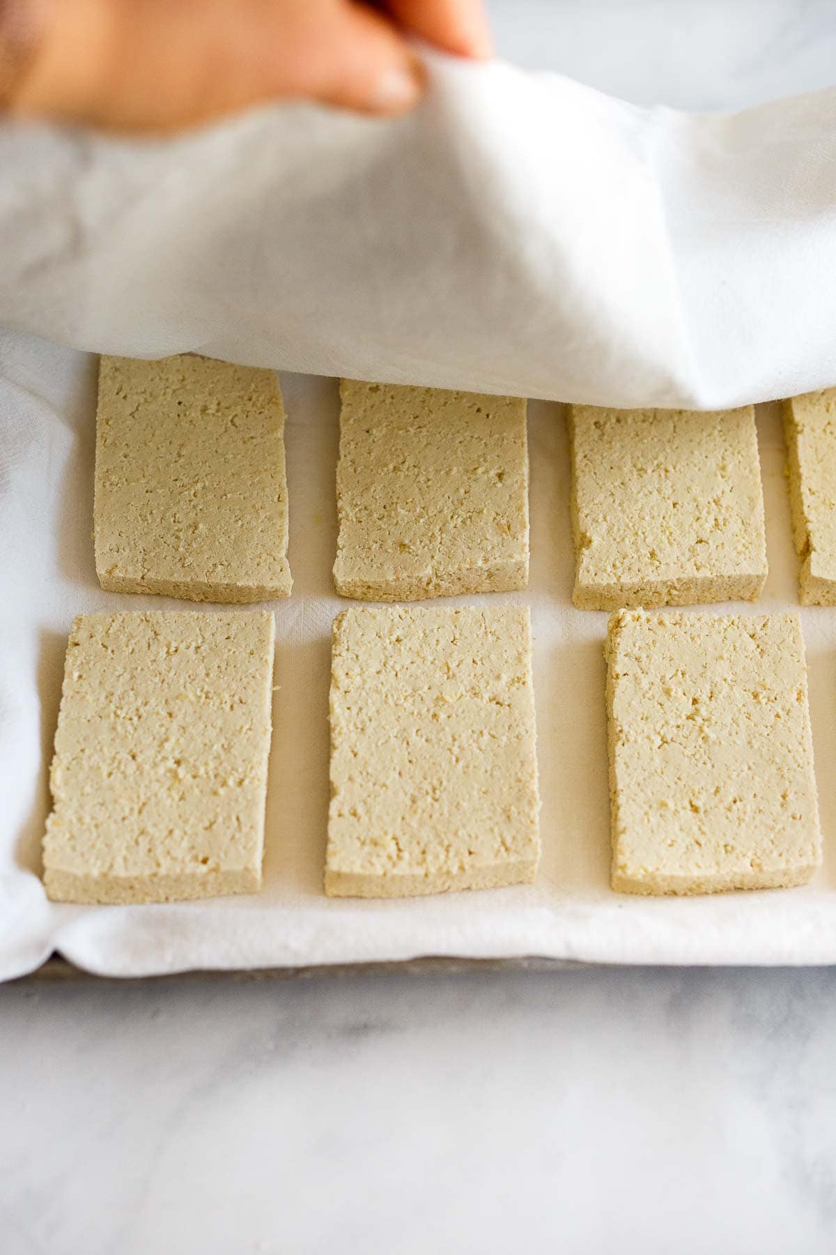 Pressing tofu.