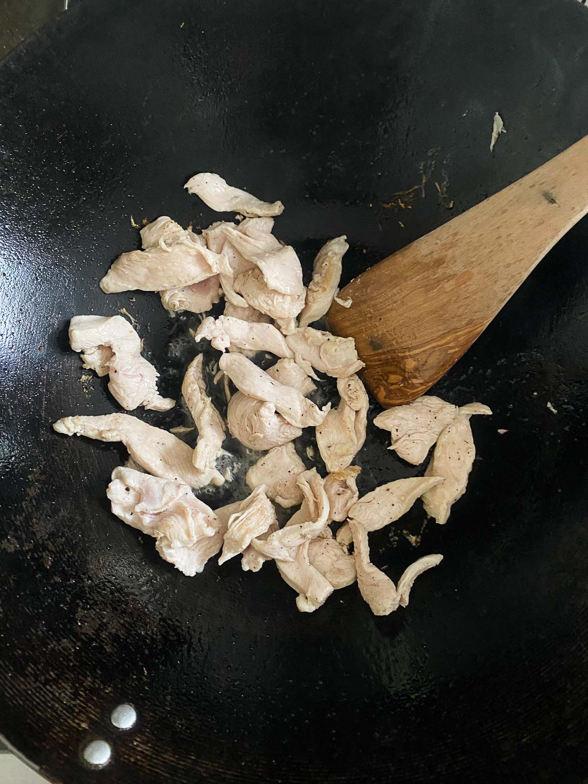 stirfriing chicken. 