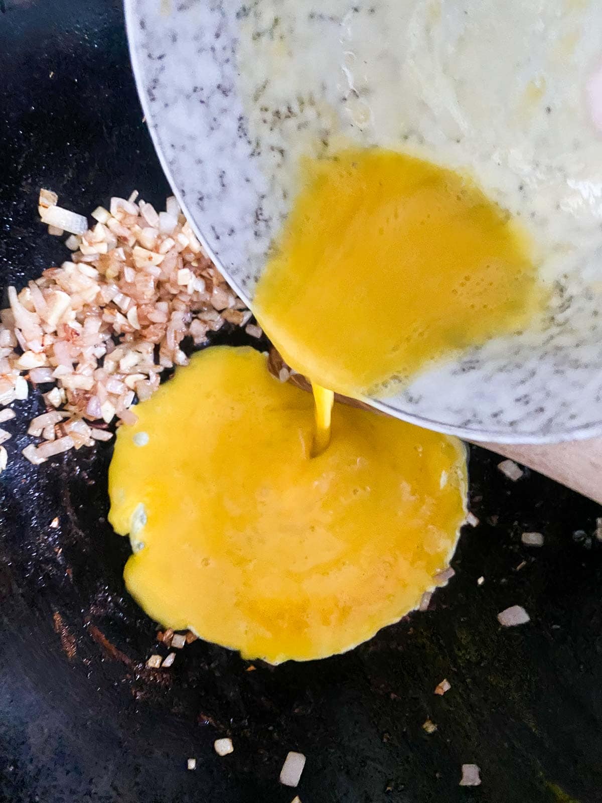 add the eggs and scramble in the wok. 